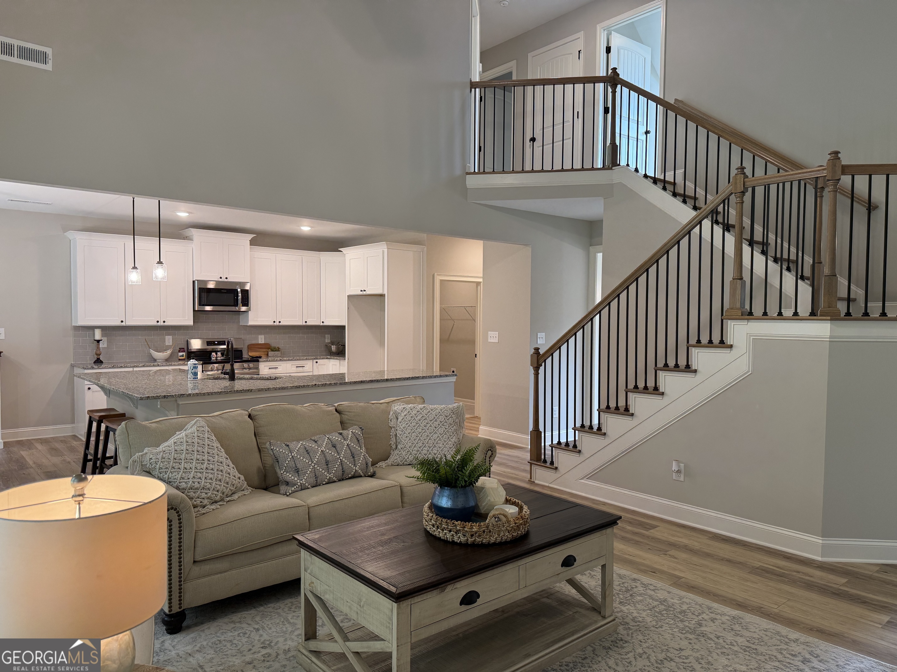 92 Commanche Circle Williamson, GA 30292 - Photo 18 of 53 a living room with furniture and a dining table