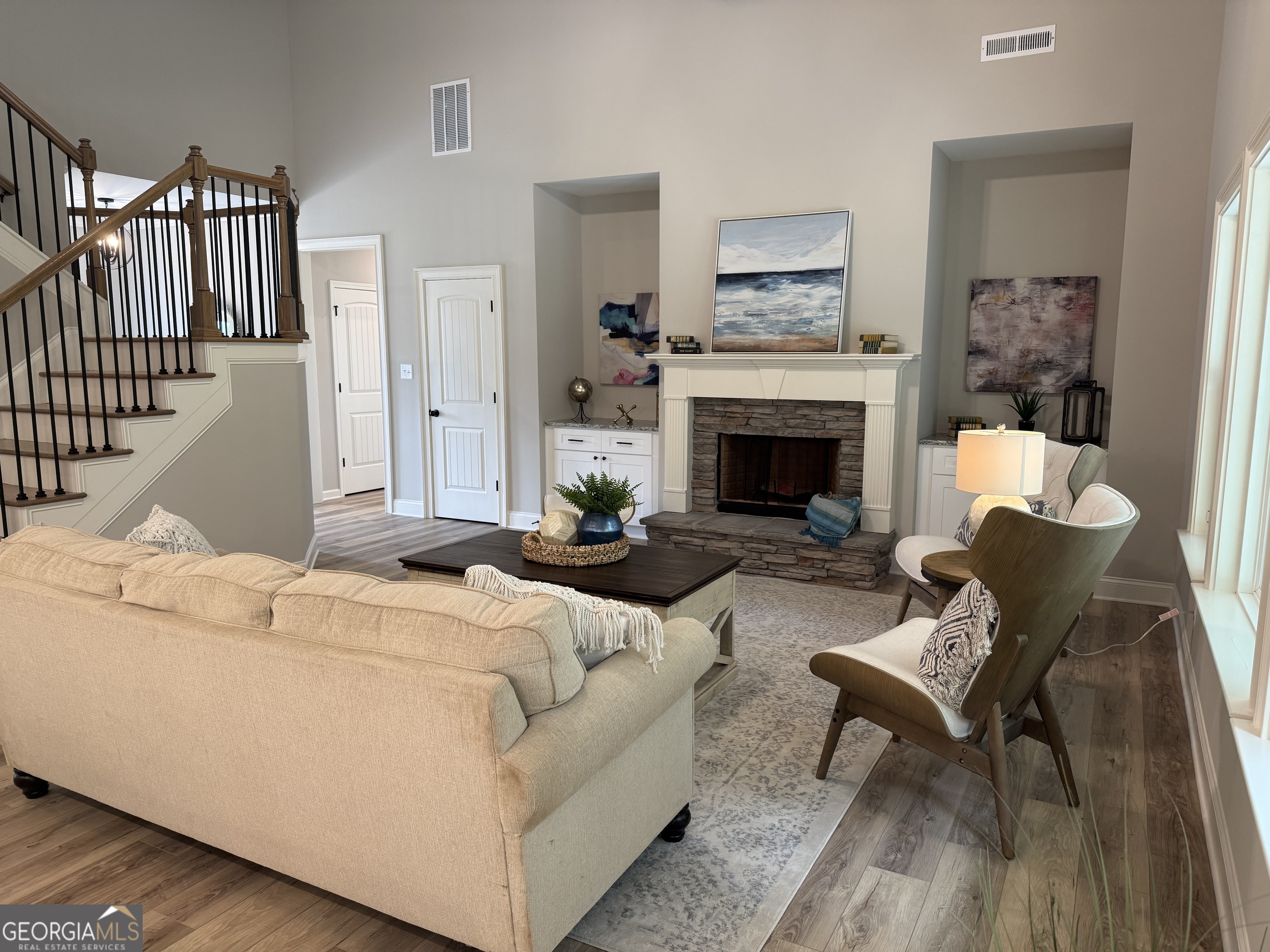 92 Commanche Circle Williamson, GA 30292 - Photo 20 of 53 a living room with furniture and a fireplace
