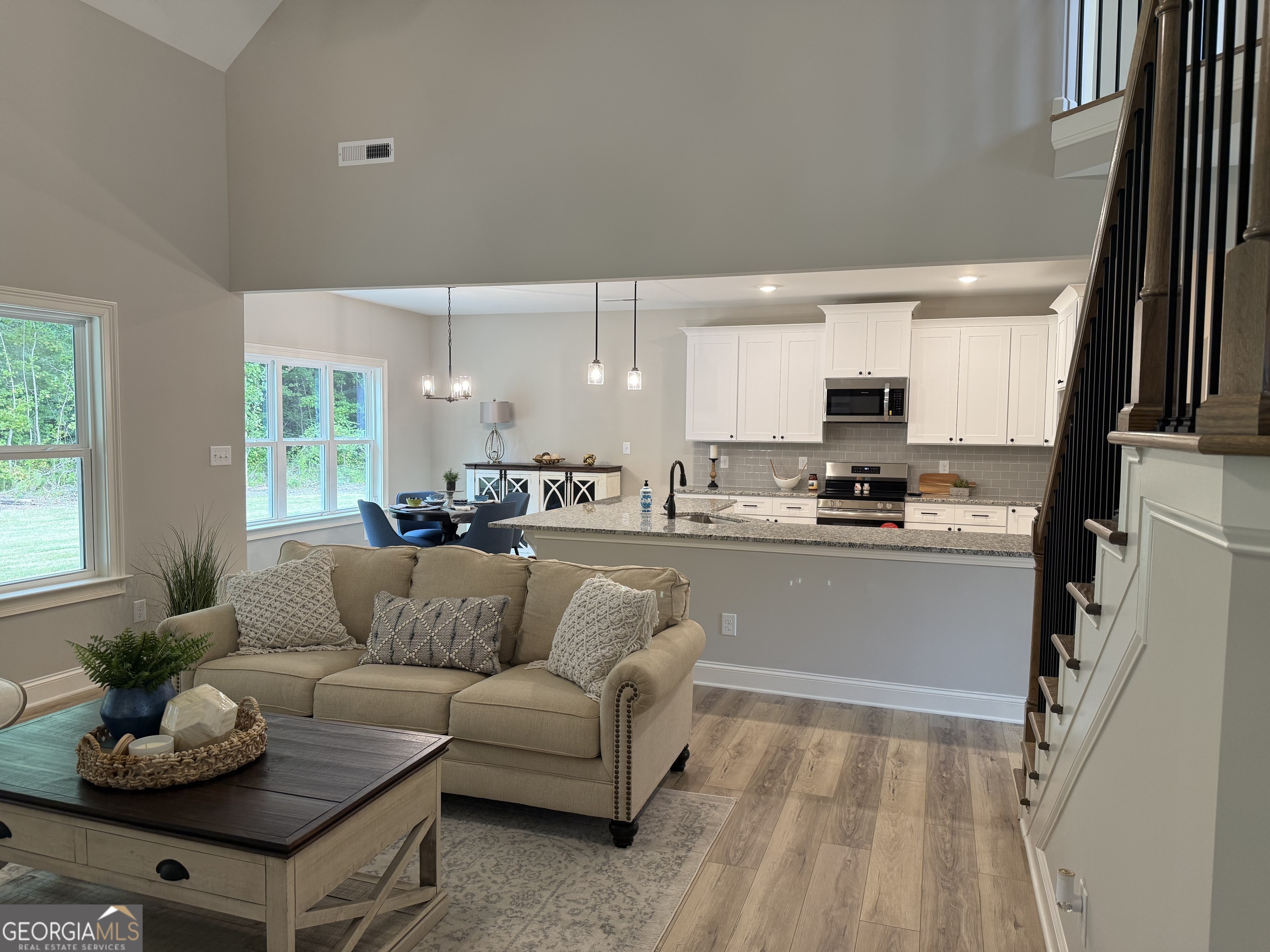 92 Commanche Circle Williamson, GA 30292 - Photo 22 of 53 a living room with furniture and kitchen view