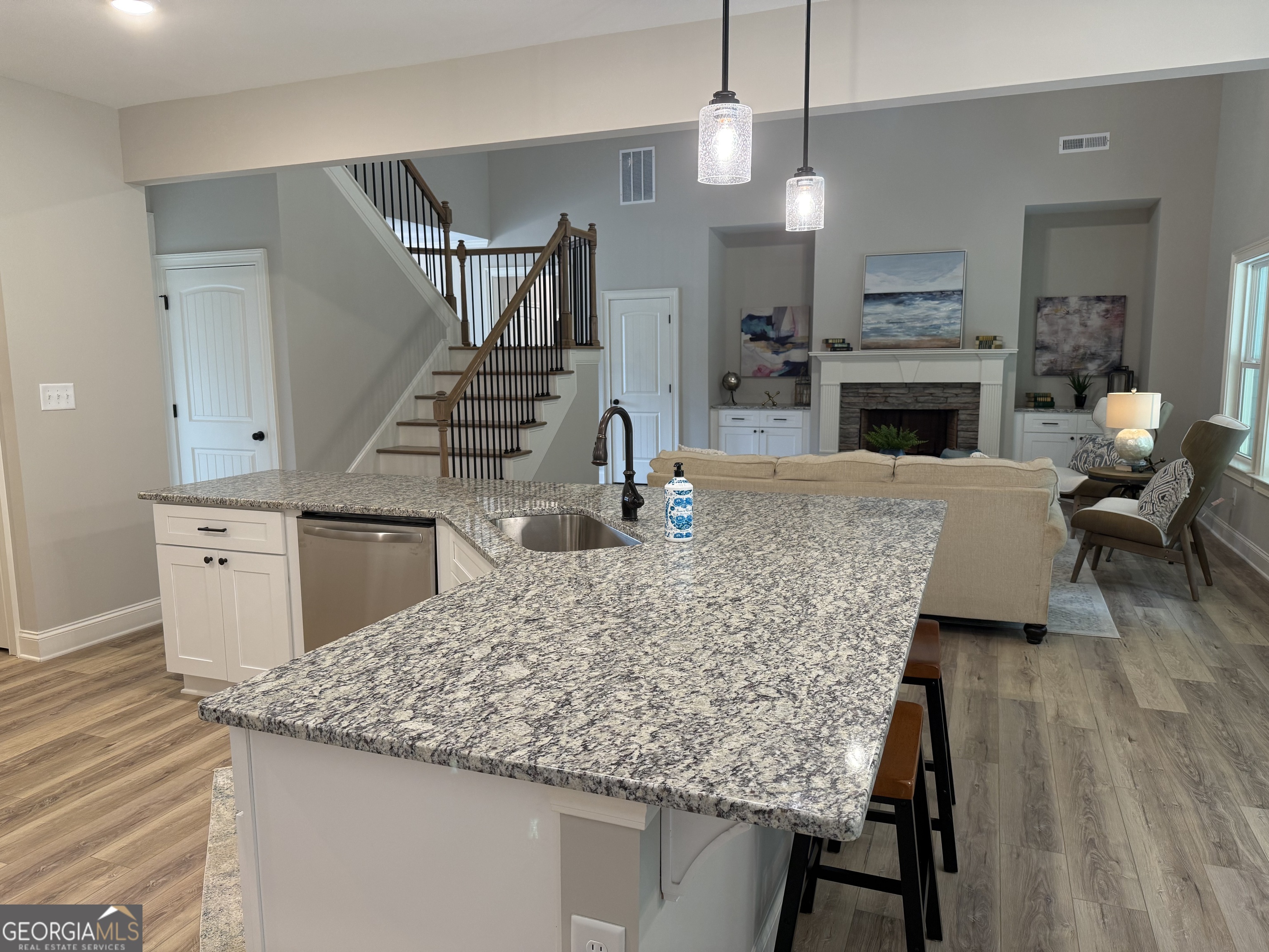92 Commanche Circle Williamson, GA 30292 - Photo 29 of 53 a kitchen with kitchen island a counter top space a sink stainless steel appliances and cabinets