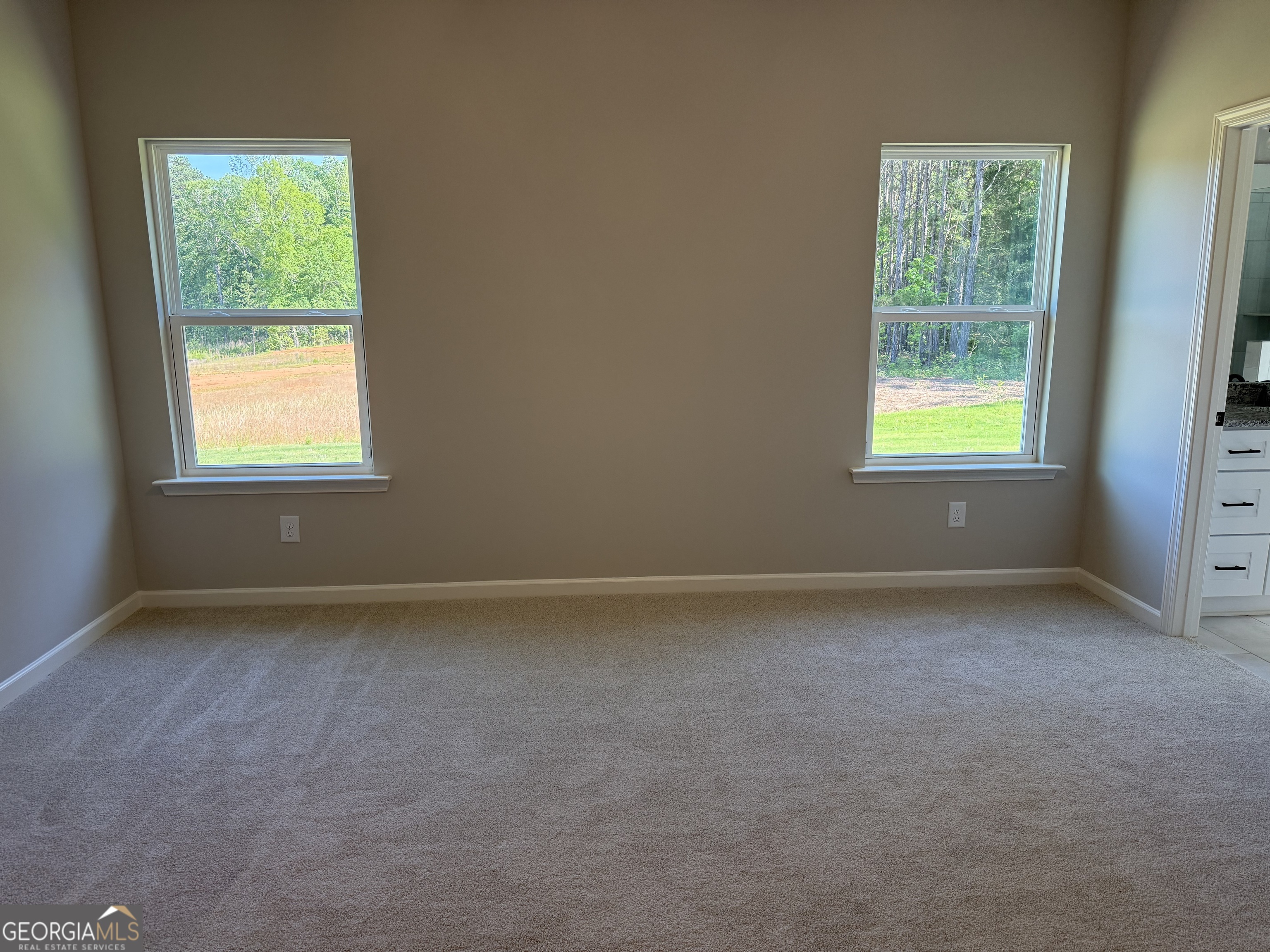 92 Commanche Circle Williamson, GA 30292 - Photo 33 of 53 an empty room with a window