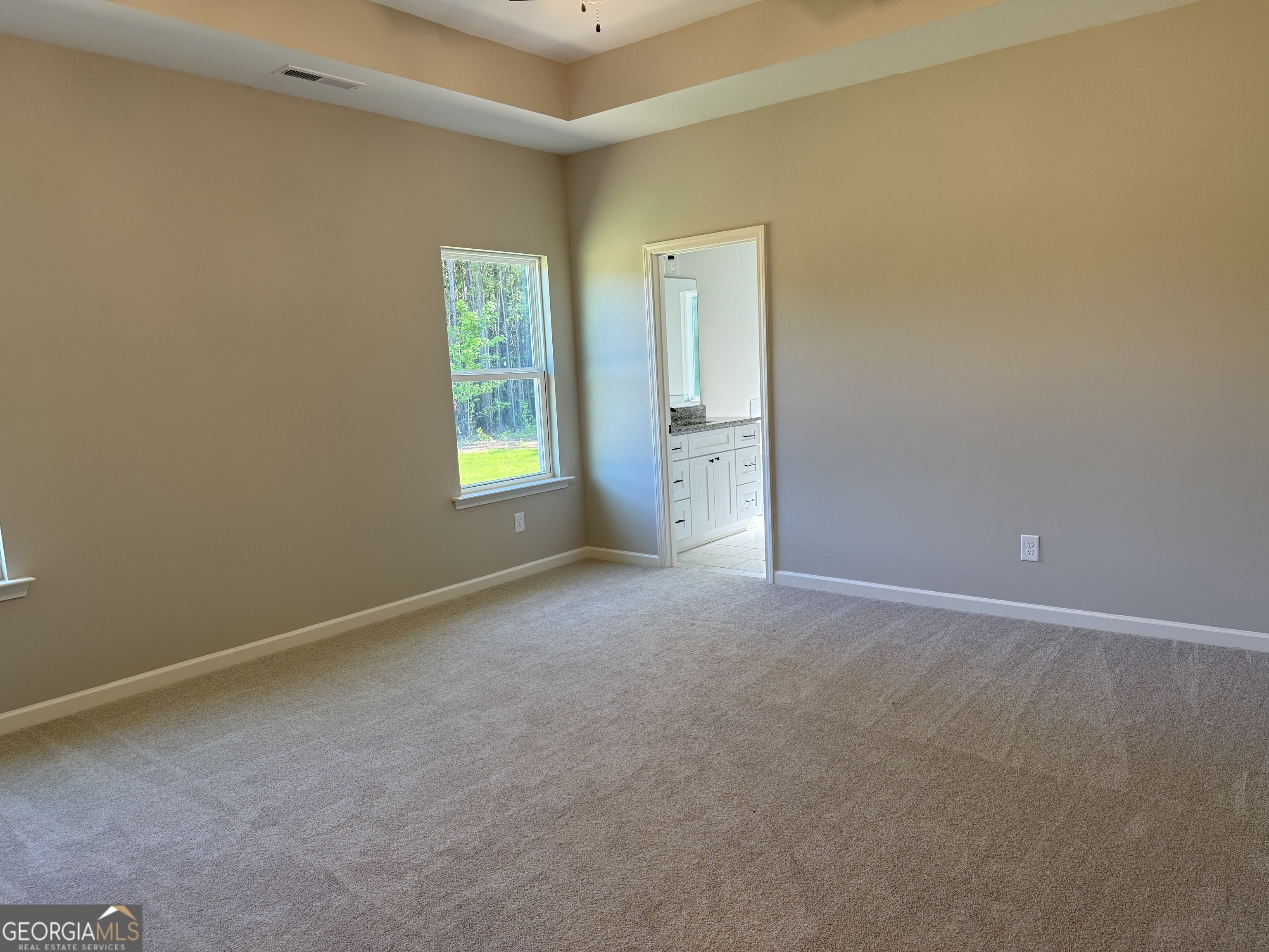 92 Commanche Circle Williamson, GA 30292 - Photo 35 of 53 a view of an empty room with window and stairs