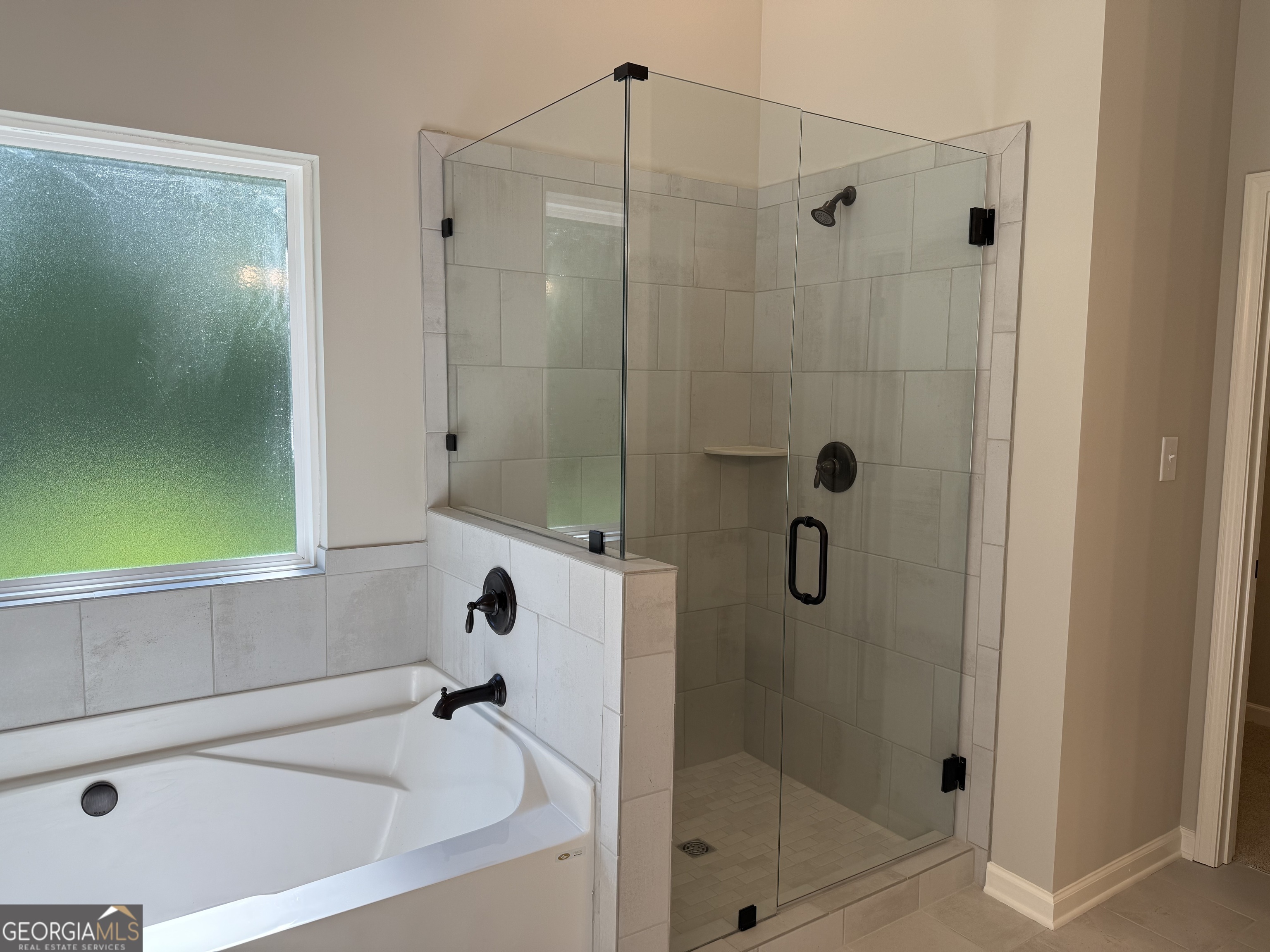 92 Commanche Circle Williamson, GA 30292 - Photo 39 of 53 a bathroom with a bathtub and shower