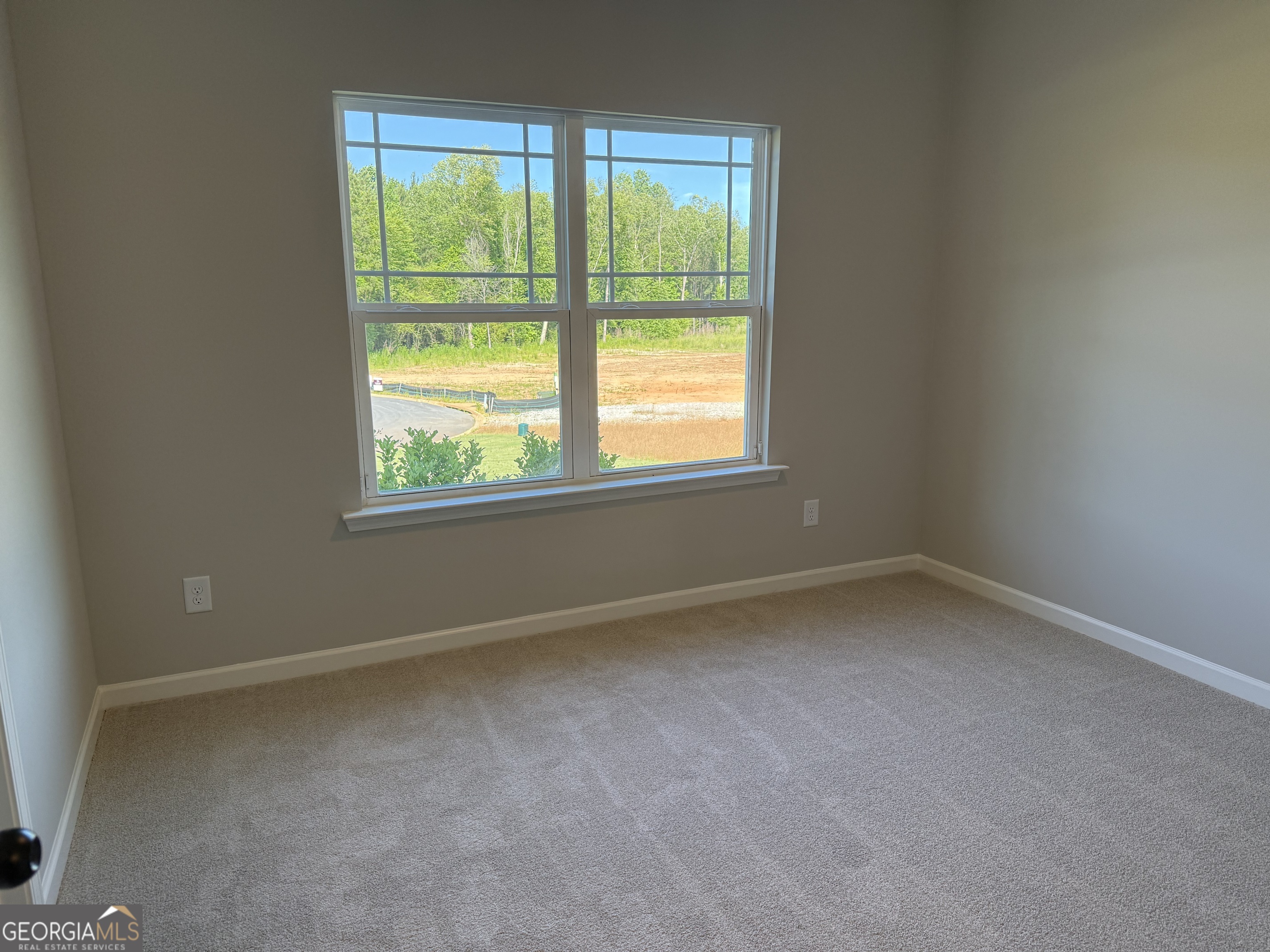 92 Commanche Circle Williamson, GA 30292 - Photo 46 of 53 an empty room with a window