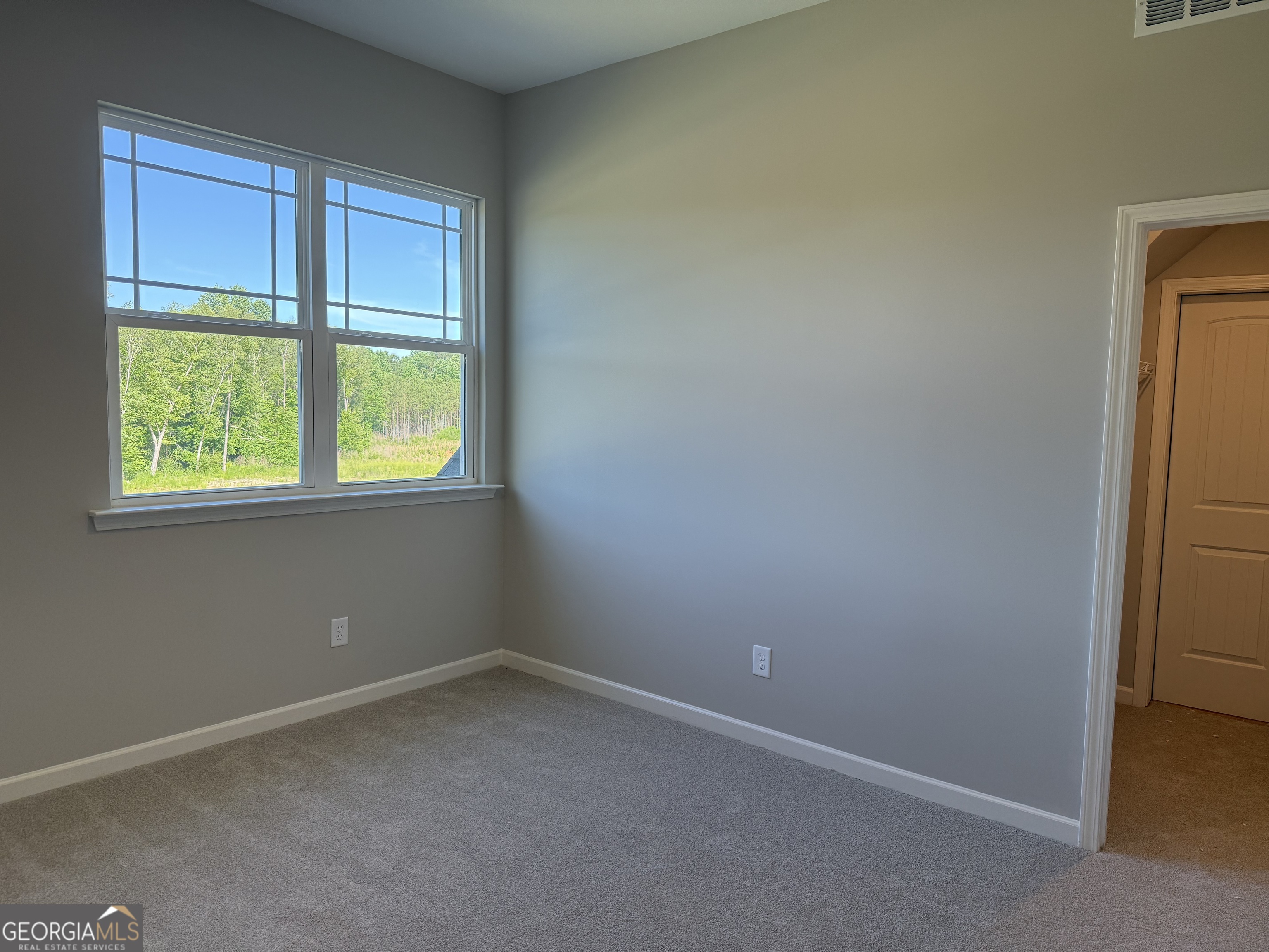 92 Commanche Circle Williamson, GA 30292 - Photo 49 of 53 an empty room with a window
