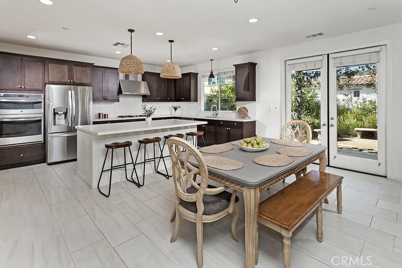 271 Rose Street Fillmore, CA 93015 - Photo 3 of 11 a view of a dining room with furniture and wooden floor