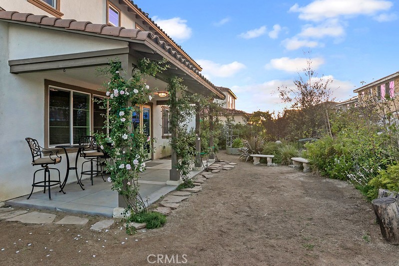 271 Rose Street Fillmore, CA 93015 - Photo 9 of 11 a view of a patio with table and chairs and potted plants