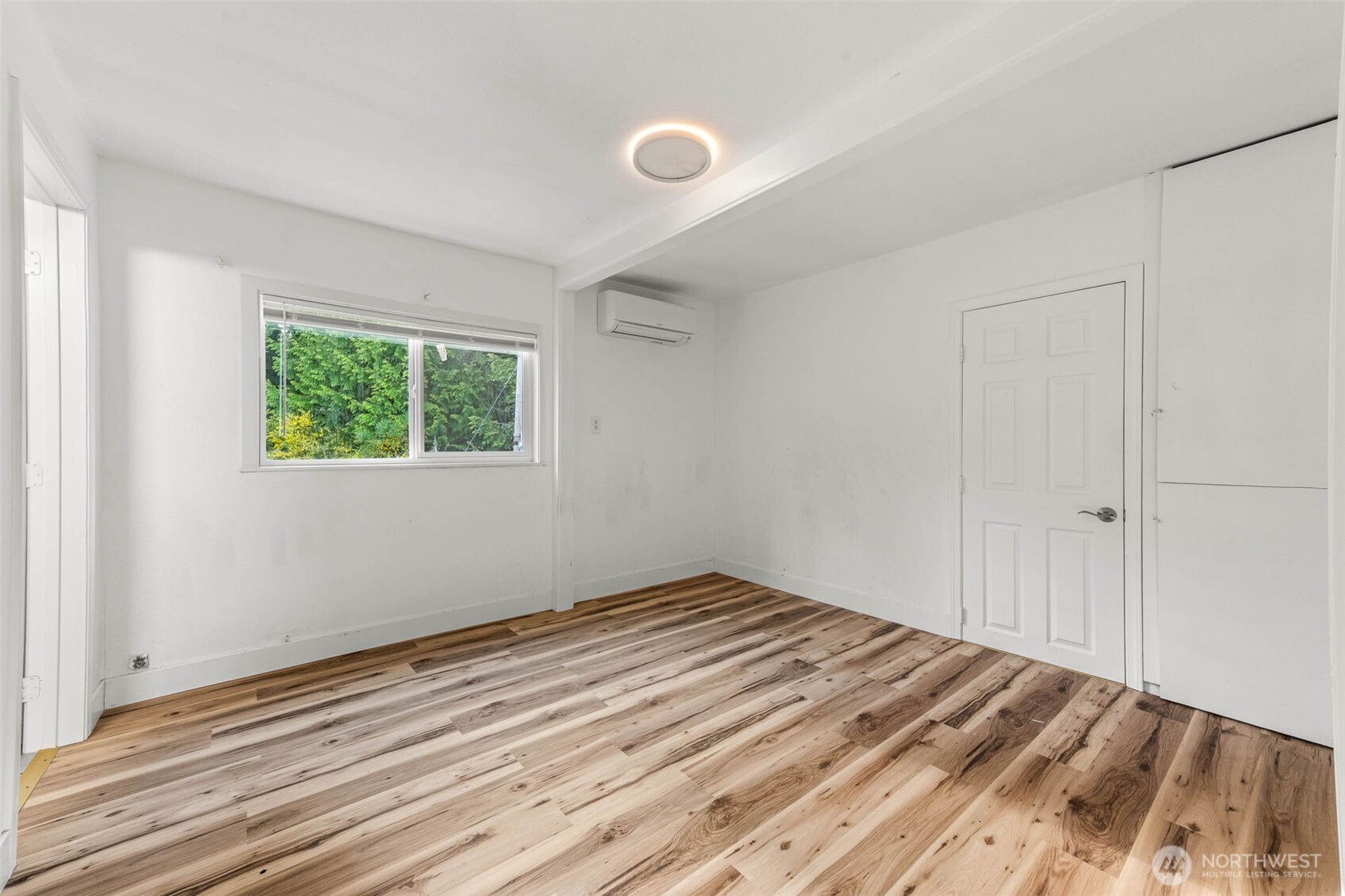 172 South Bank Road Elma, WA 98541 - Photo 22 of 40 a view of empty room with wooden floor and fan