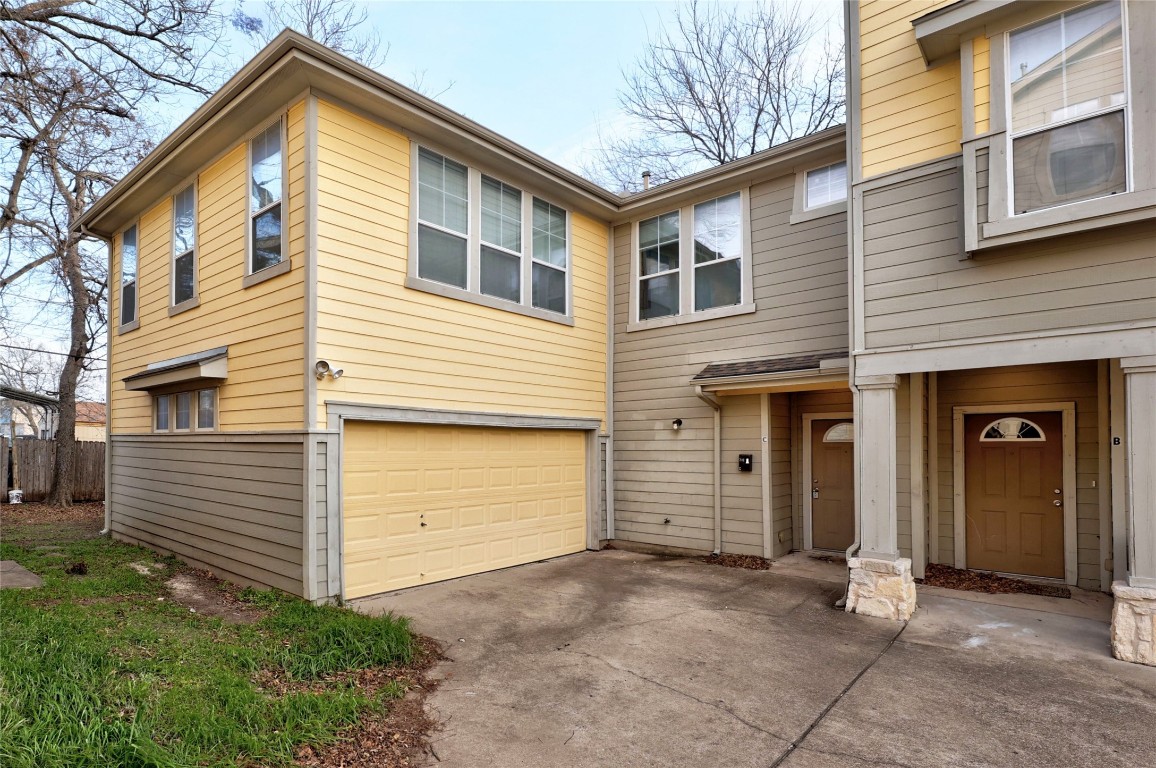710 Franklin Boulevard, Unit C Austin, TX 78751 - Photo 1 of 30 a view of a house with a yard and garage