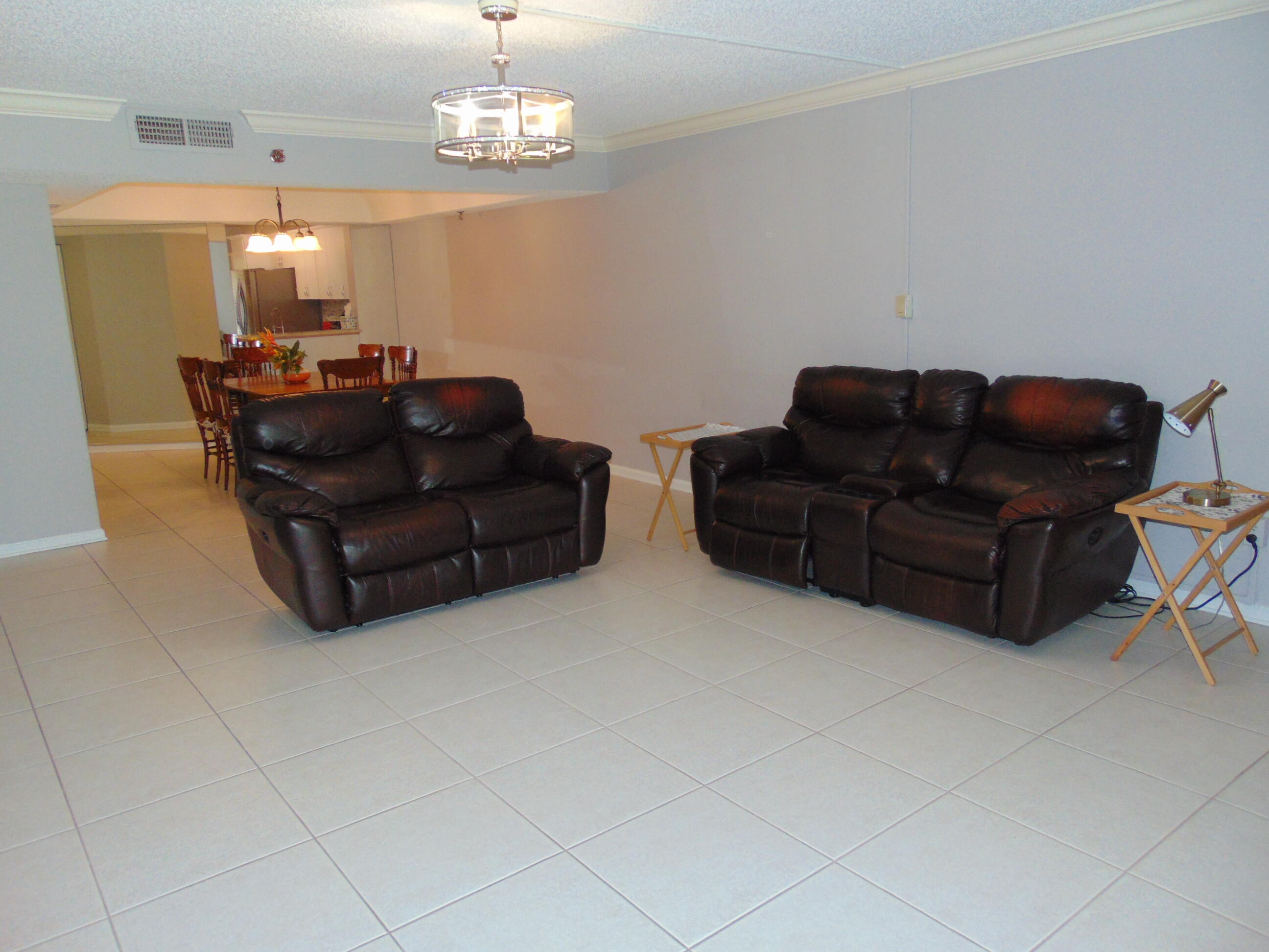 9220 Southwest 14th Street, Unit 3103 Boca Raton, FL 33428 - Photo 13 of 58 a living room with couches and livingroom view