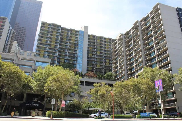 a view of a building and yard