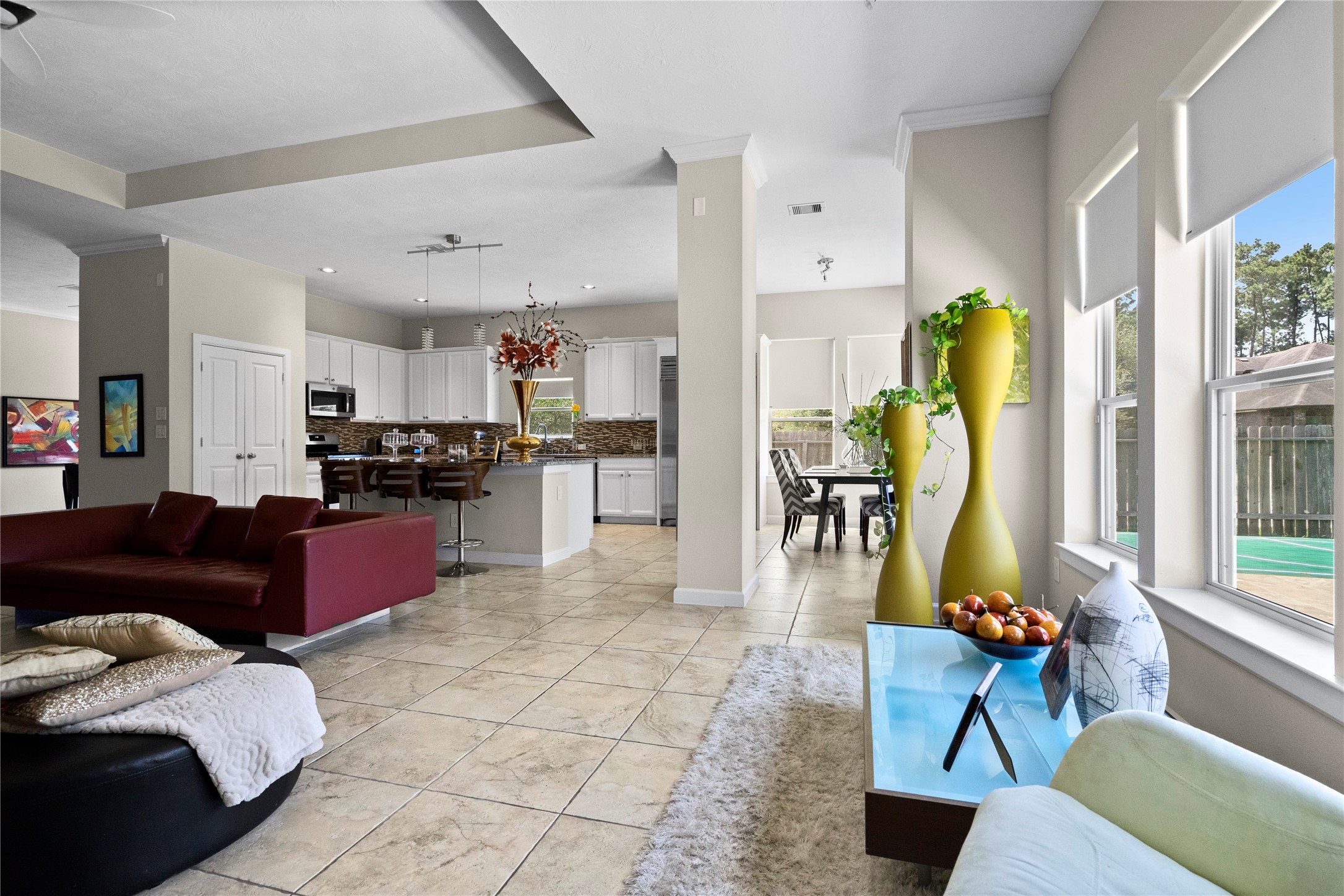 31503 Reston Cliff Court Spring, TX 77386 - Photo 6 of 28 a living room with stainless steel appliances kitchen island granite countertop furniture and a rug