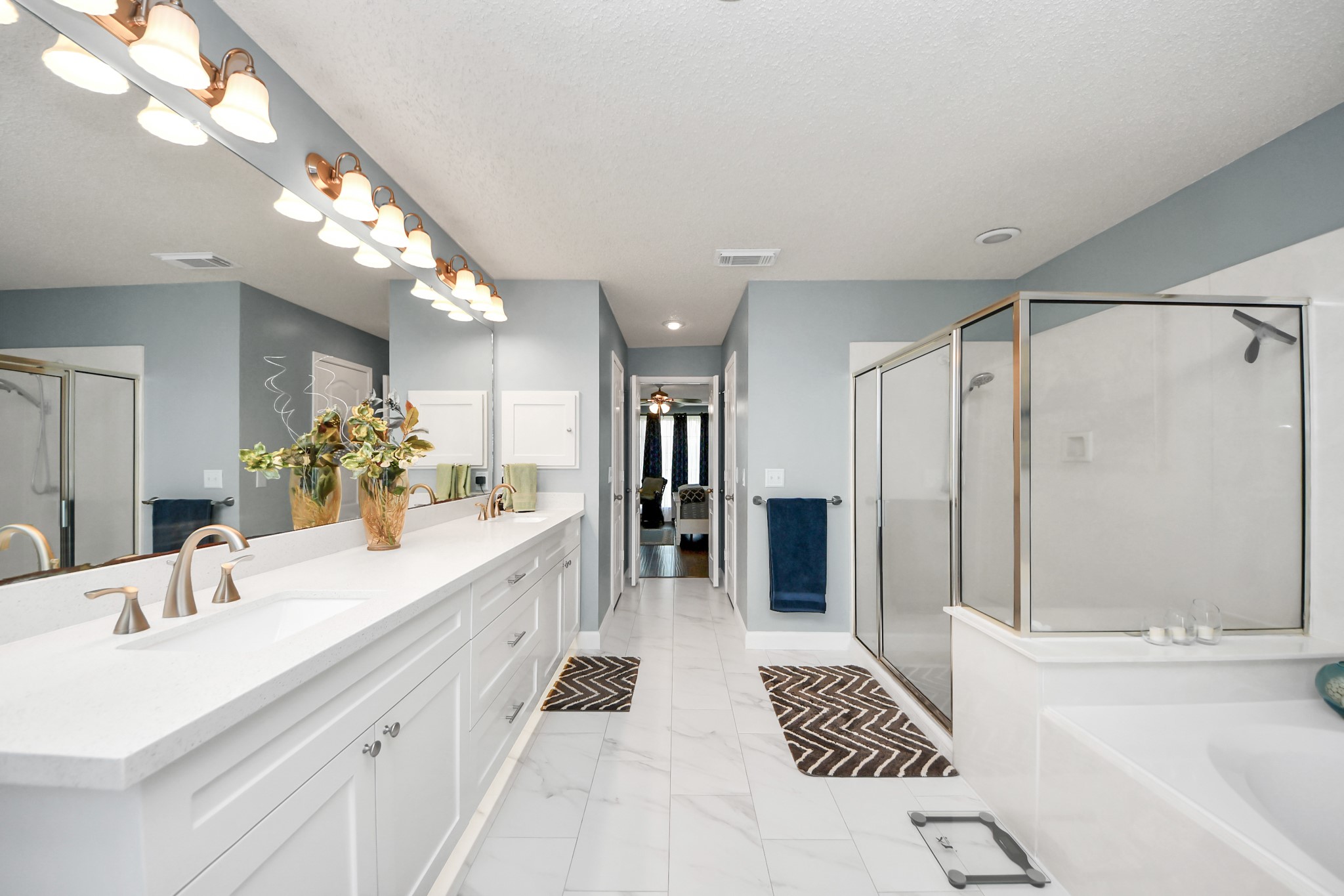 3107 Dulaney Road Houston, TX 77084 - Photo 21 of 50 a spacious bathroom with a double vanity sink a large mirror and shower
