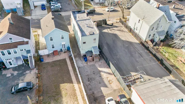 an aerial view of residential houses with outdoor space