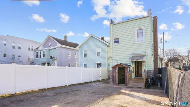 a view of a house with a yard and garage