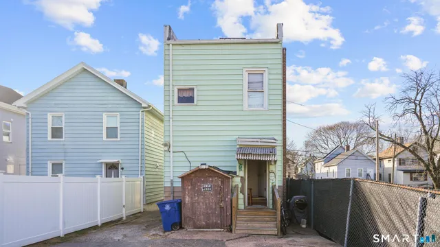 a view of a house with a yard and garage