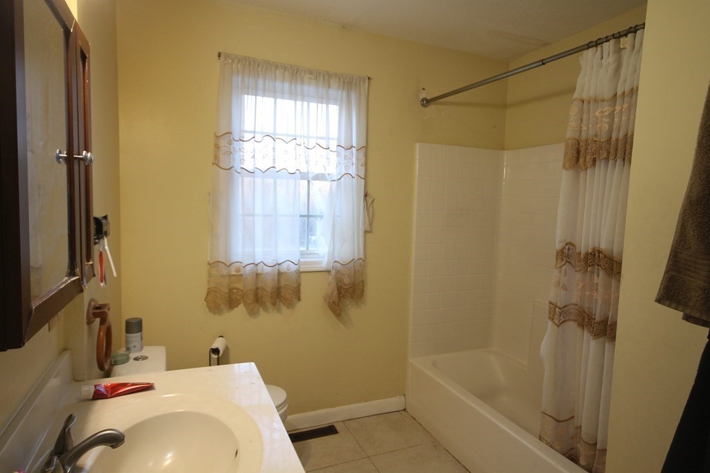 39 Martha Street Springfield, MA 01151 - Photo 8 of 18 a bathroom with a sink and a bathtub