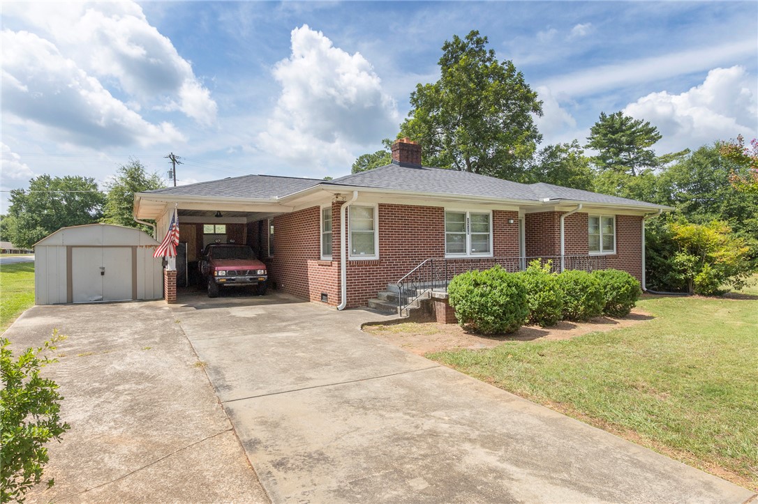 1218 Bolt Drive Anderson, SC 29621 - Photo 3 of 46 Brick facade and covered parking define this charming single-level residence.