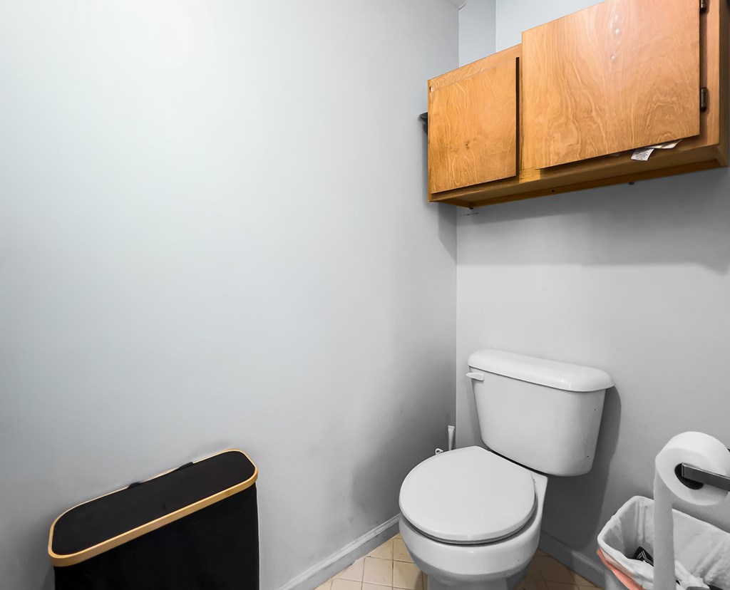 1085 Terry Lane Fortson, GA 31808 - Photo 14 of 21 a white toilet sitting next to a bathroom sink