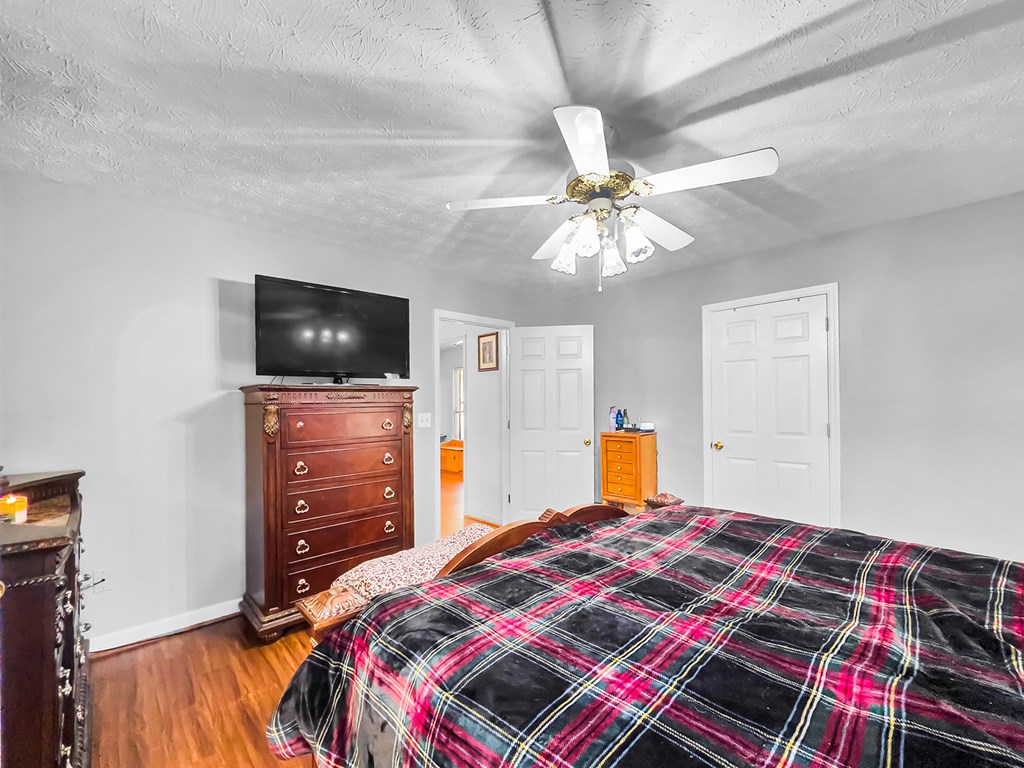 1085 Terry Lane Fortson, GA 31808 - Photo 16 of 21 a bedroom with a bed and a flat screen tv