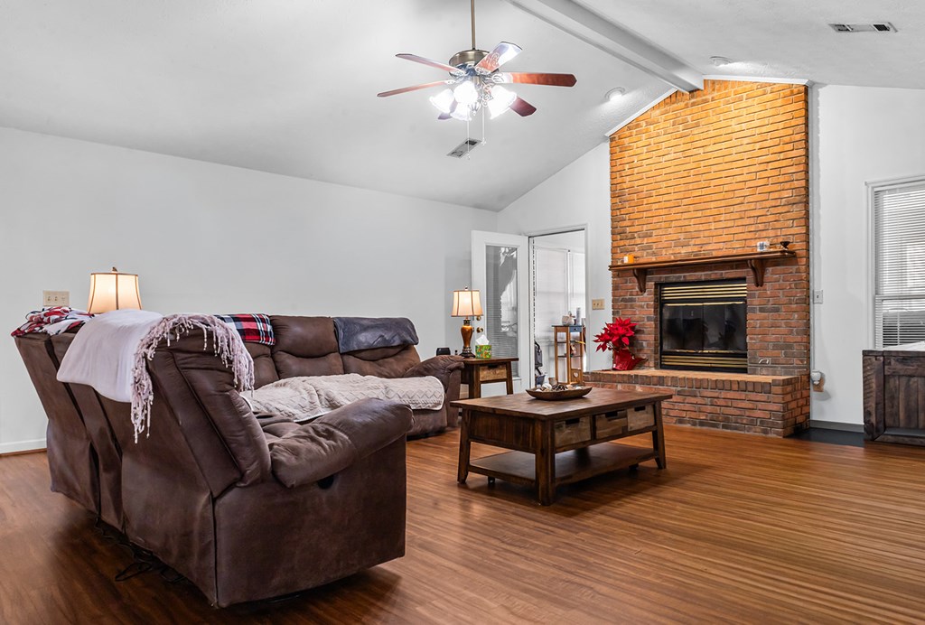 1085 Terry Lane Fortson, GA 31808 - Photo 8 of 21 a living room with furniture fireplace and wooden floor