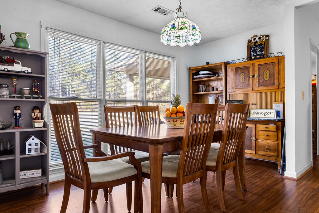 1085 Terry Lane Fortson, GA 31808 - Photo 9 of 21 a view of a dining room with furniture window and wooden floor