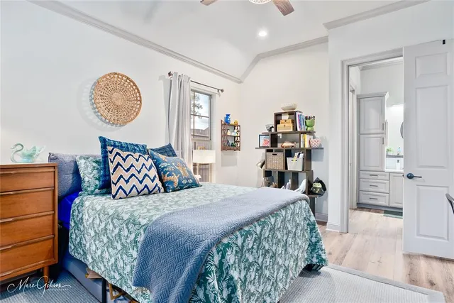 a bedroom with a large bed and a closet