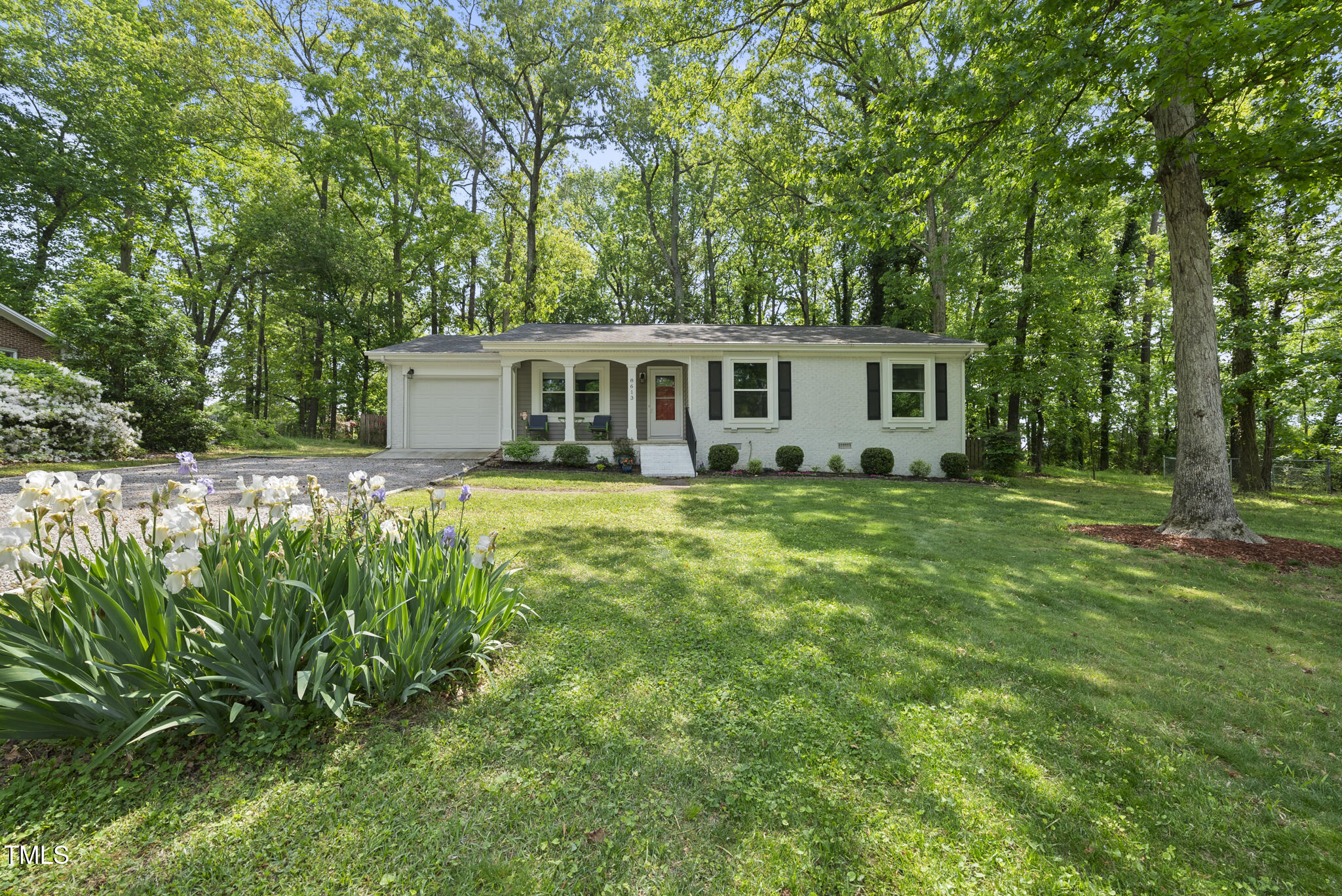8613 Lobelia Street Raleigh, NC 27603 - Photo 1 of 25 a house view with a garden space