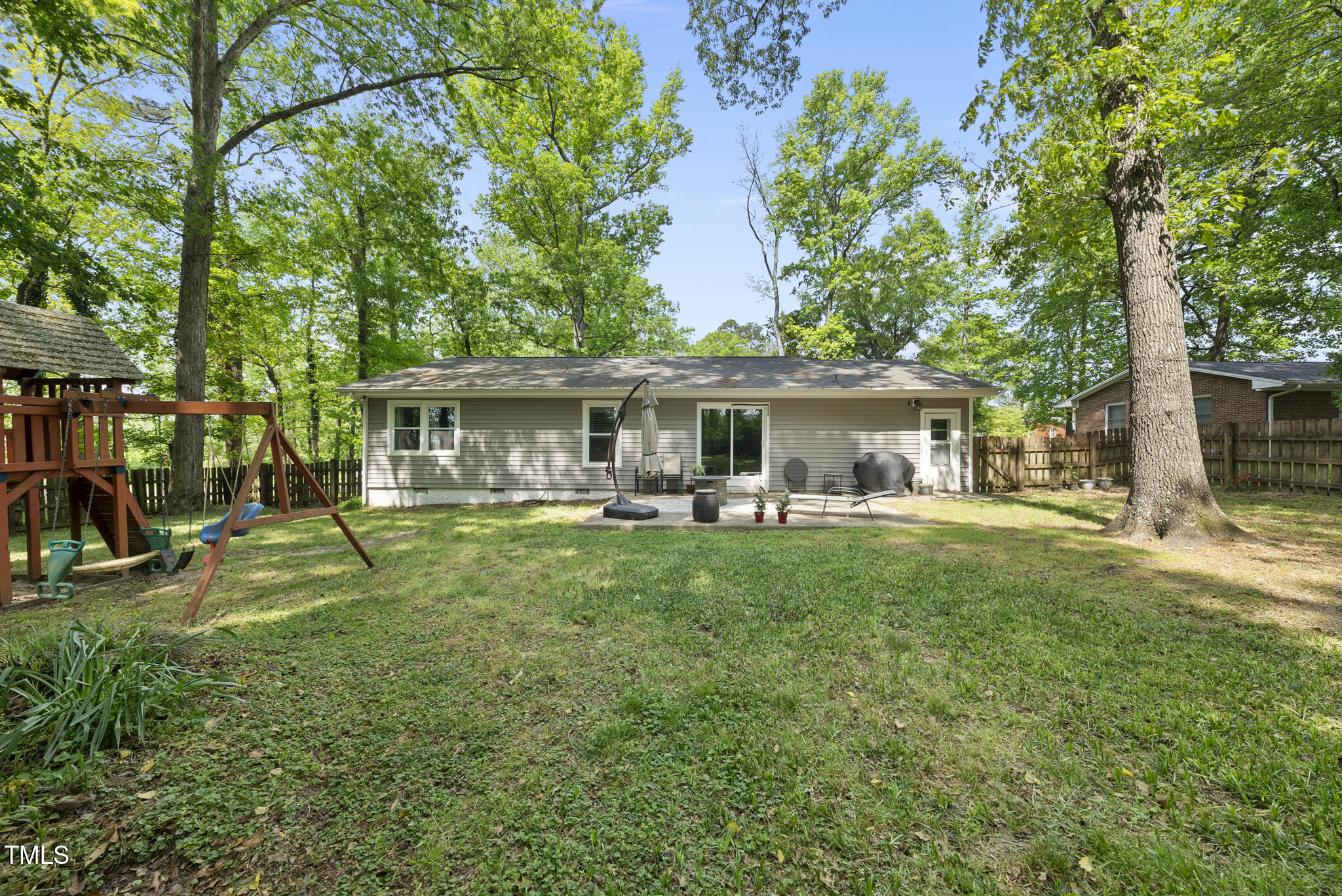 8613 Lobelia Street Raleigh, NC 27603 - Photo 24 of 25 a front view of a house with yard patio and green space