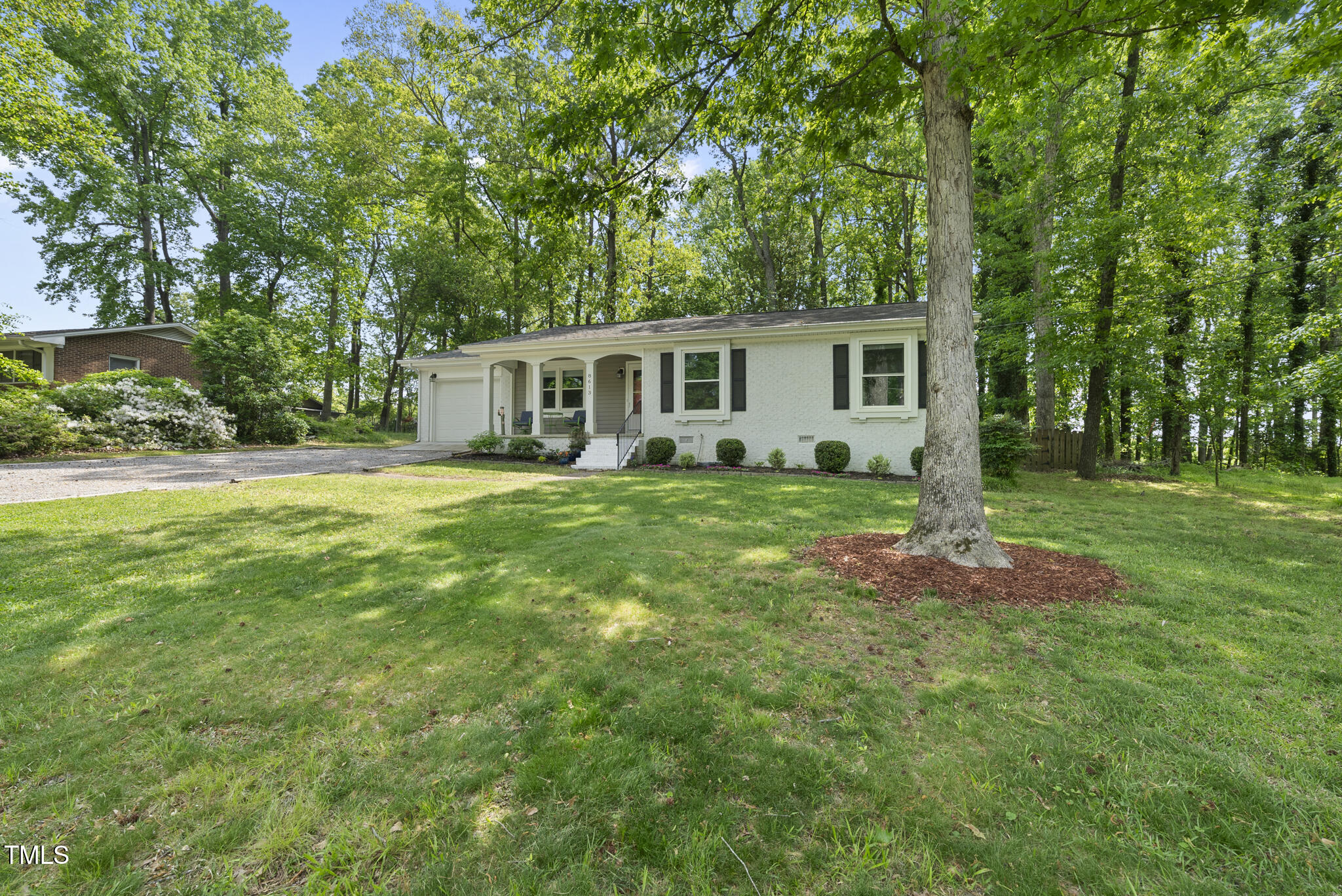 8613 Lobelia Street Raleigh, NC 27603 - Photo 2 of 25 a view of a house with a big yard
