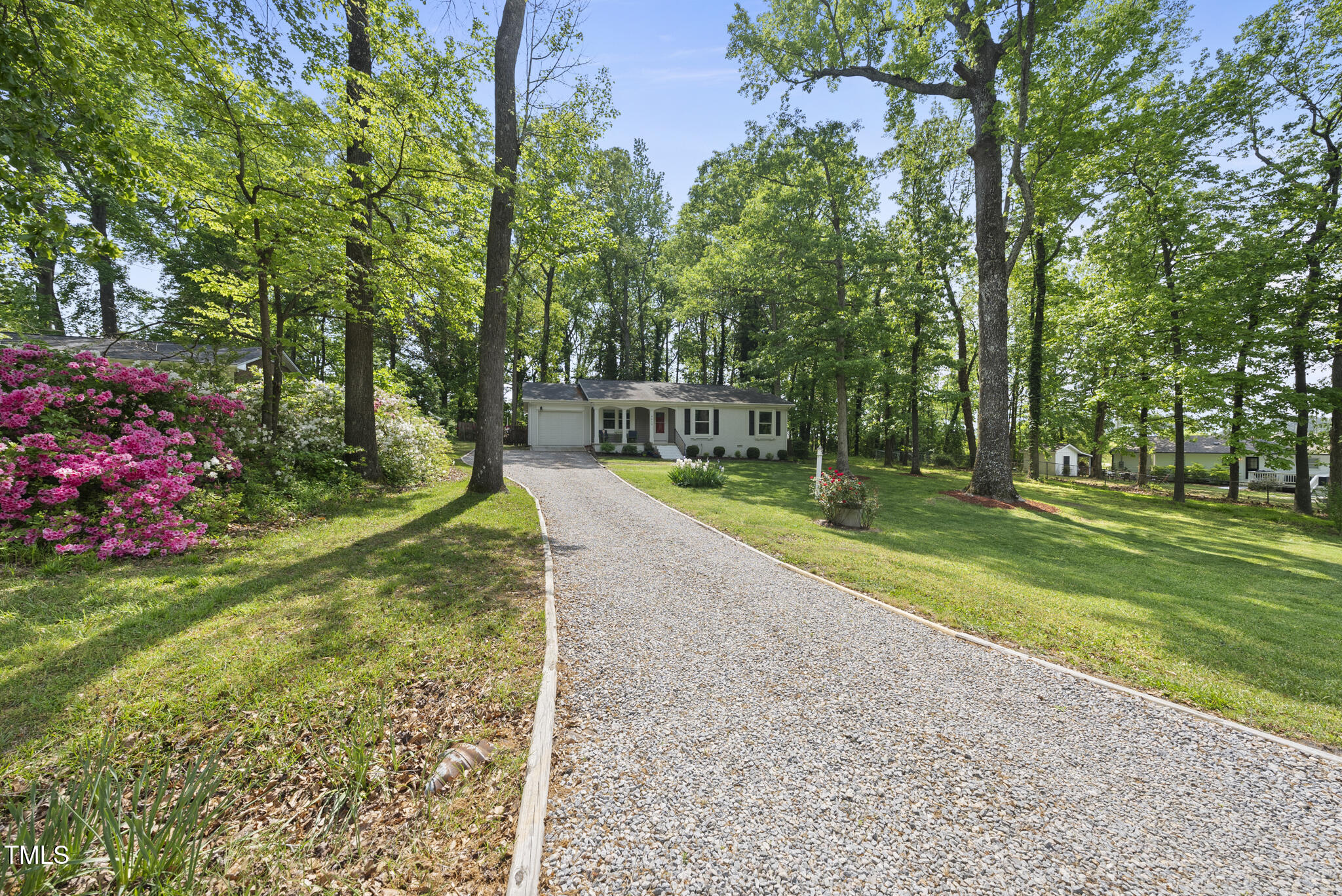 8613 Lobelia Street Raleigh, NC 27603 - Photo 4 of 25 a view of a park with large trees