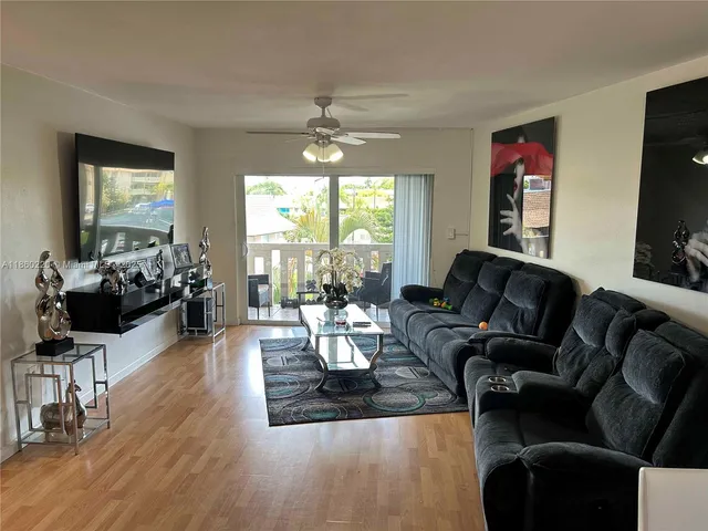 a living room with furniture or couch and a flat screen tv