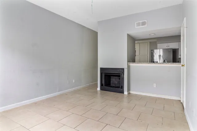 an empty room with fireplace