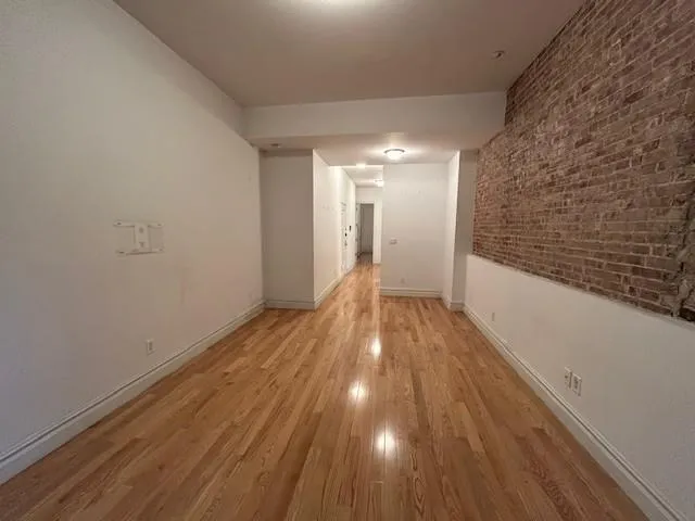 a view of wooden floor in an empty room