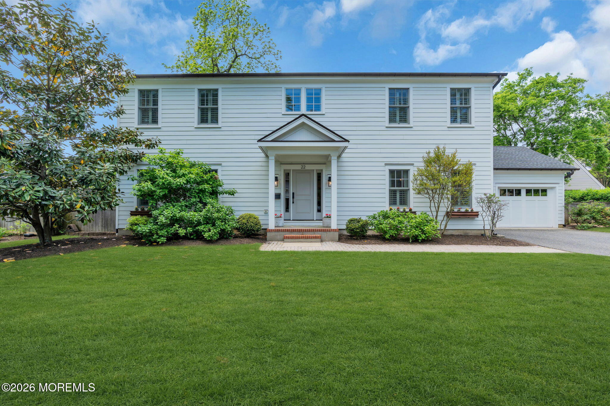 22 1st Street Rumson, NJ 07760 - Photo 1 of 44 a front view of a house with a yard