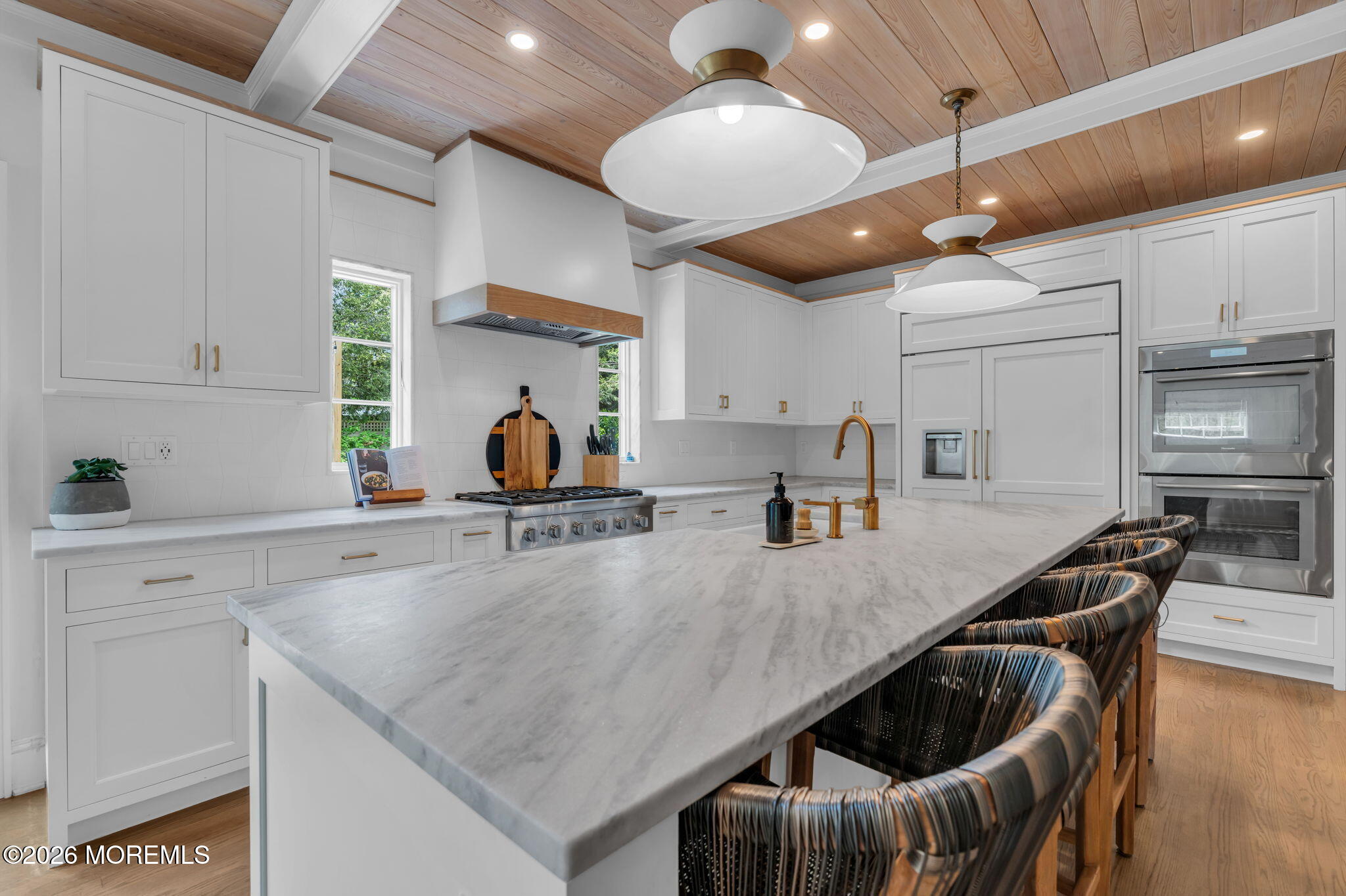22 1st Street Rumson, NJ 07760 - Photo 11 of 44 a kitchen with stainless steel appliances granite countertop a sink a stove and a refrigerator