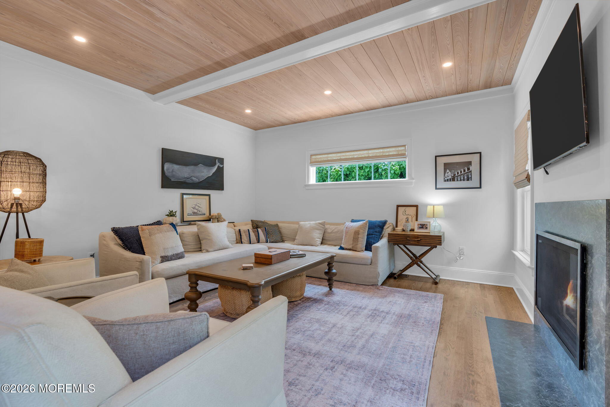 22 1st Street Rumson, NJ 07760 - Photo 13 of 44 a living room with furniture and a flat screen tv