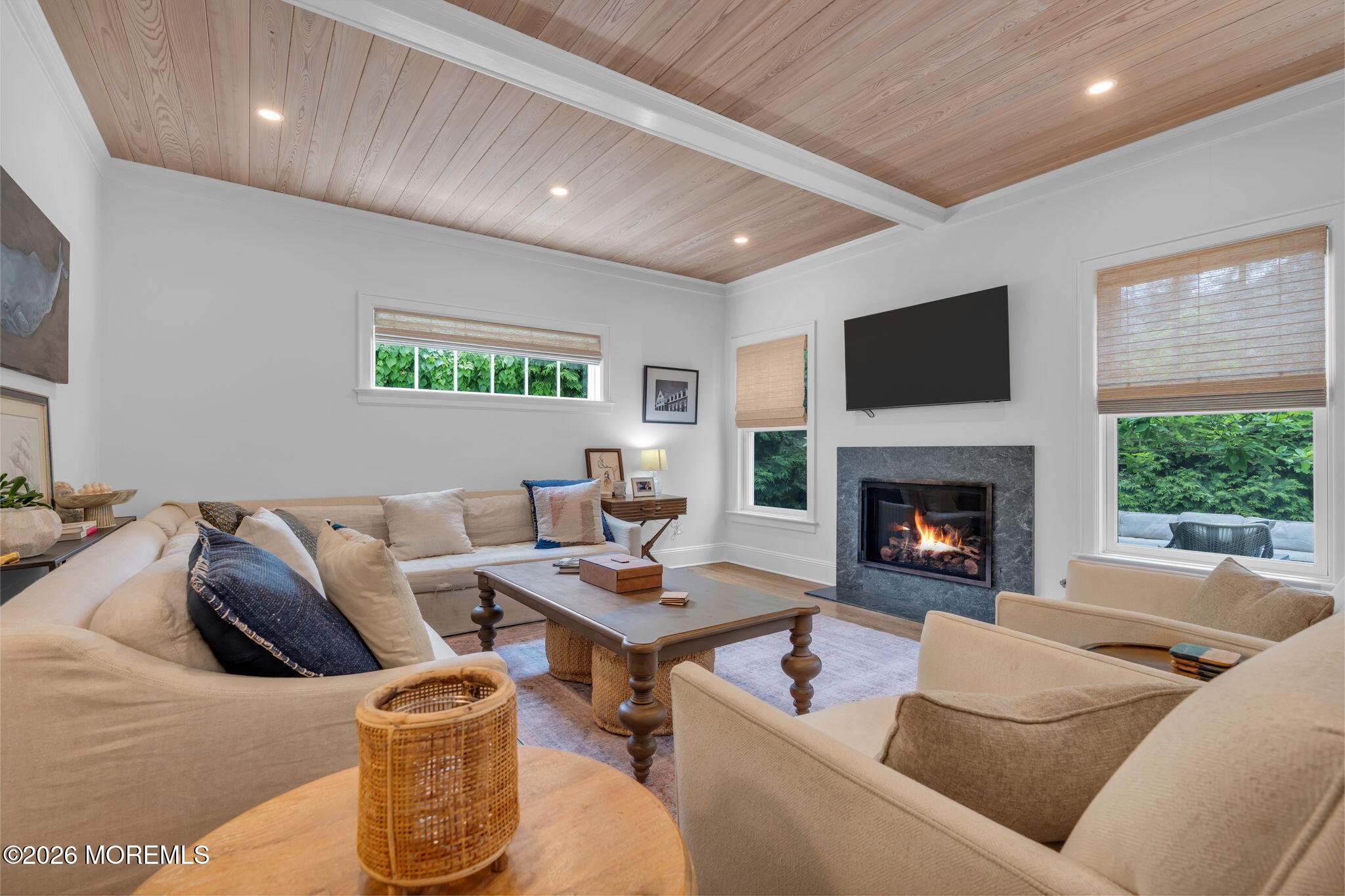 22 1st Street Rumson, NJ 07760 - Photo 15 of 44 a living room with furniture fireplace and a flat screen tv