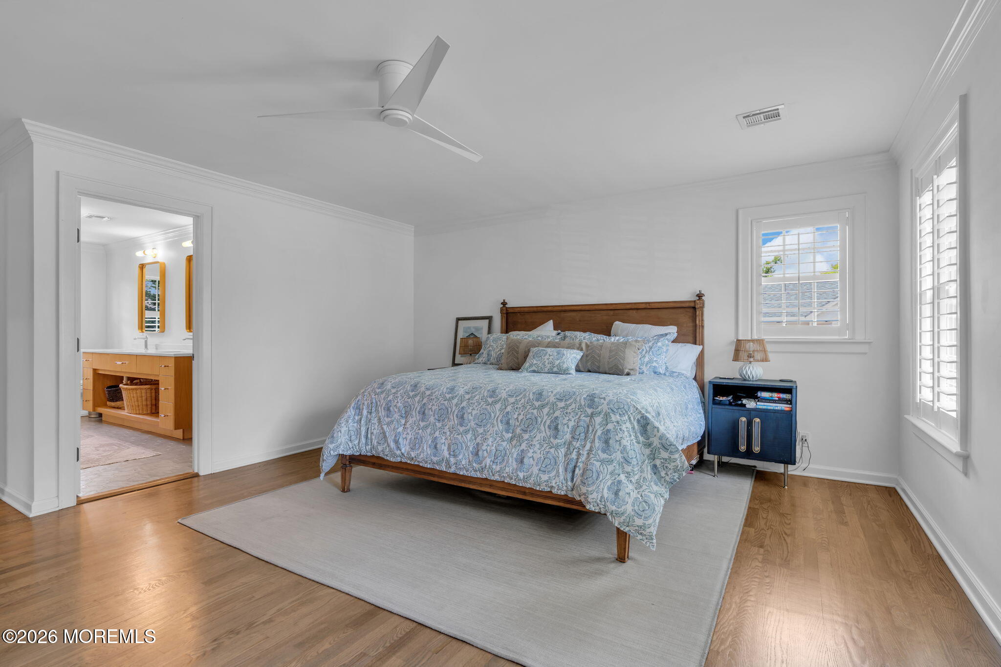 22 1st Street Rumson, NJ 07760 - Photo 26 of 44 a bedroom with a large bed and wooden floor