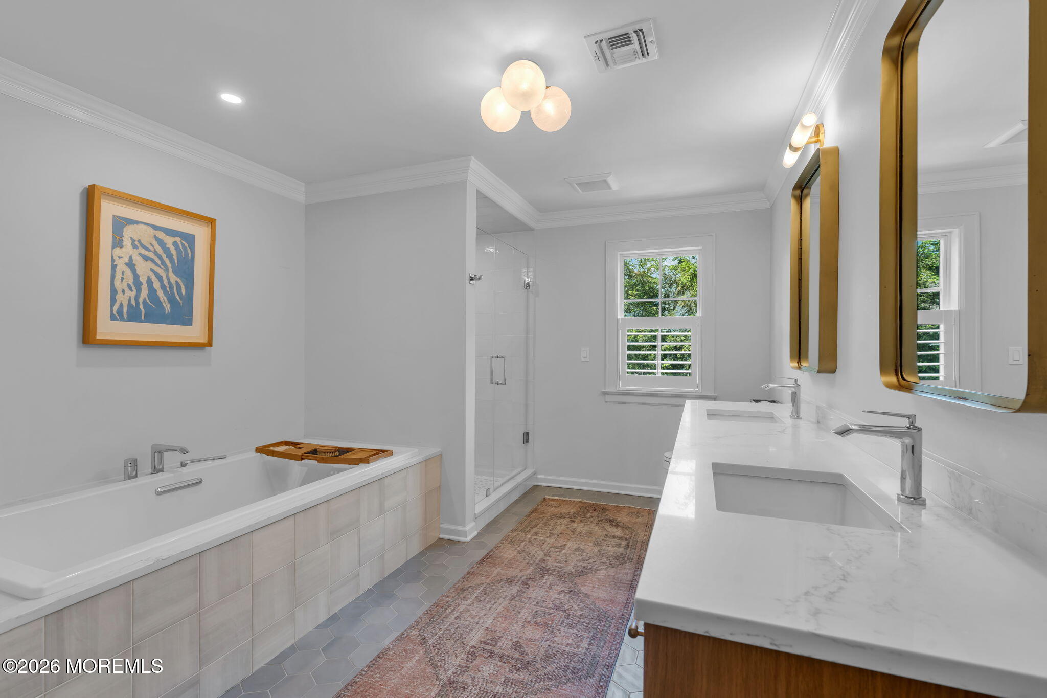 22 1st Street Rumson, NJ 07760 - Photo 27 of 44 a spacious bathroom with a tub double sink and a mirror
