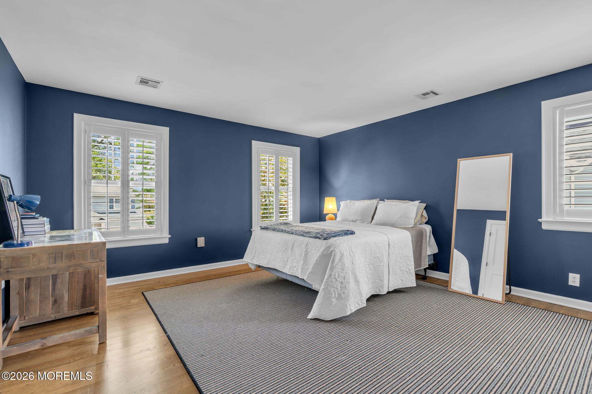 22 1st Street Rumson, NJ 07760 - Photo 31 of 44 a bed room with a bed and a night stand