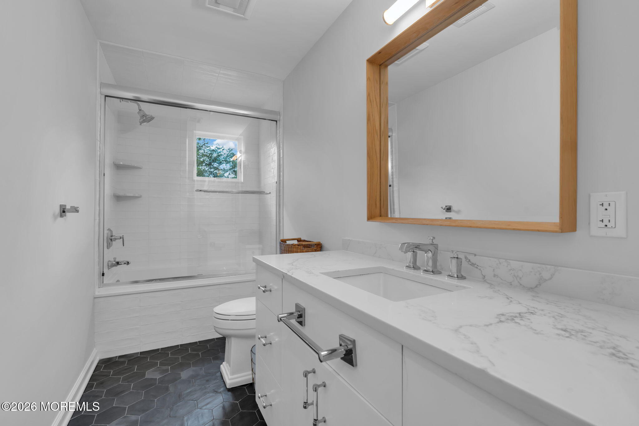 22 1st Street Rumson, NJ 07760 - Photo 35 of 44 a bathroom with a sink a toilet and shower