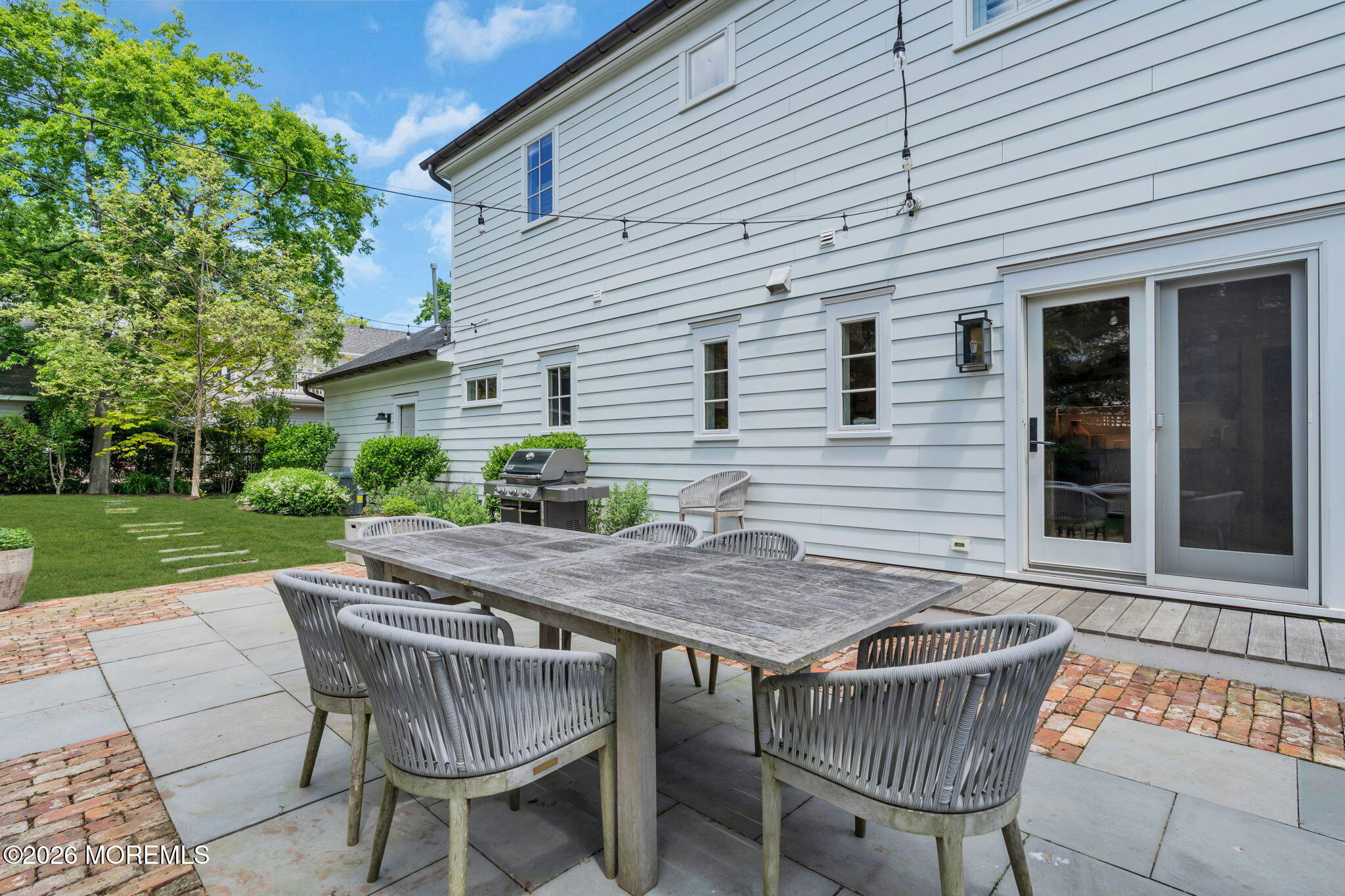 22 1st Street Rumson, NJ 07760 - Photo 38 of 44 a view of patio with table and chairs
