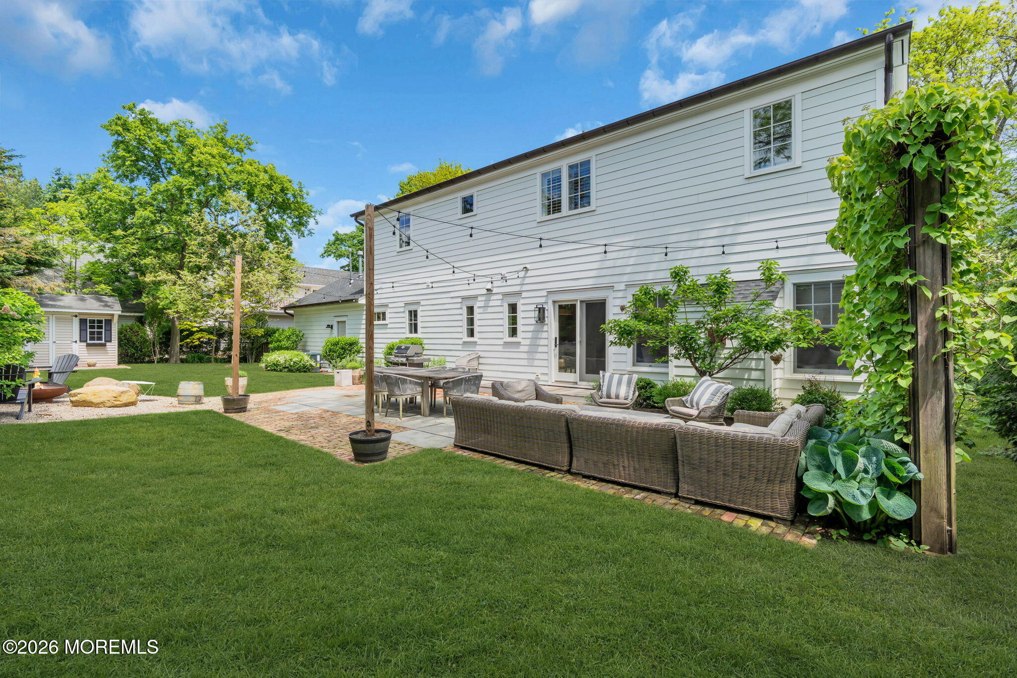 22 1st Street Rumson, NJ 07760 - Photo 39 of 44 a patio with plants and large trees