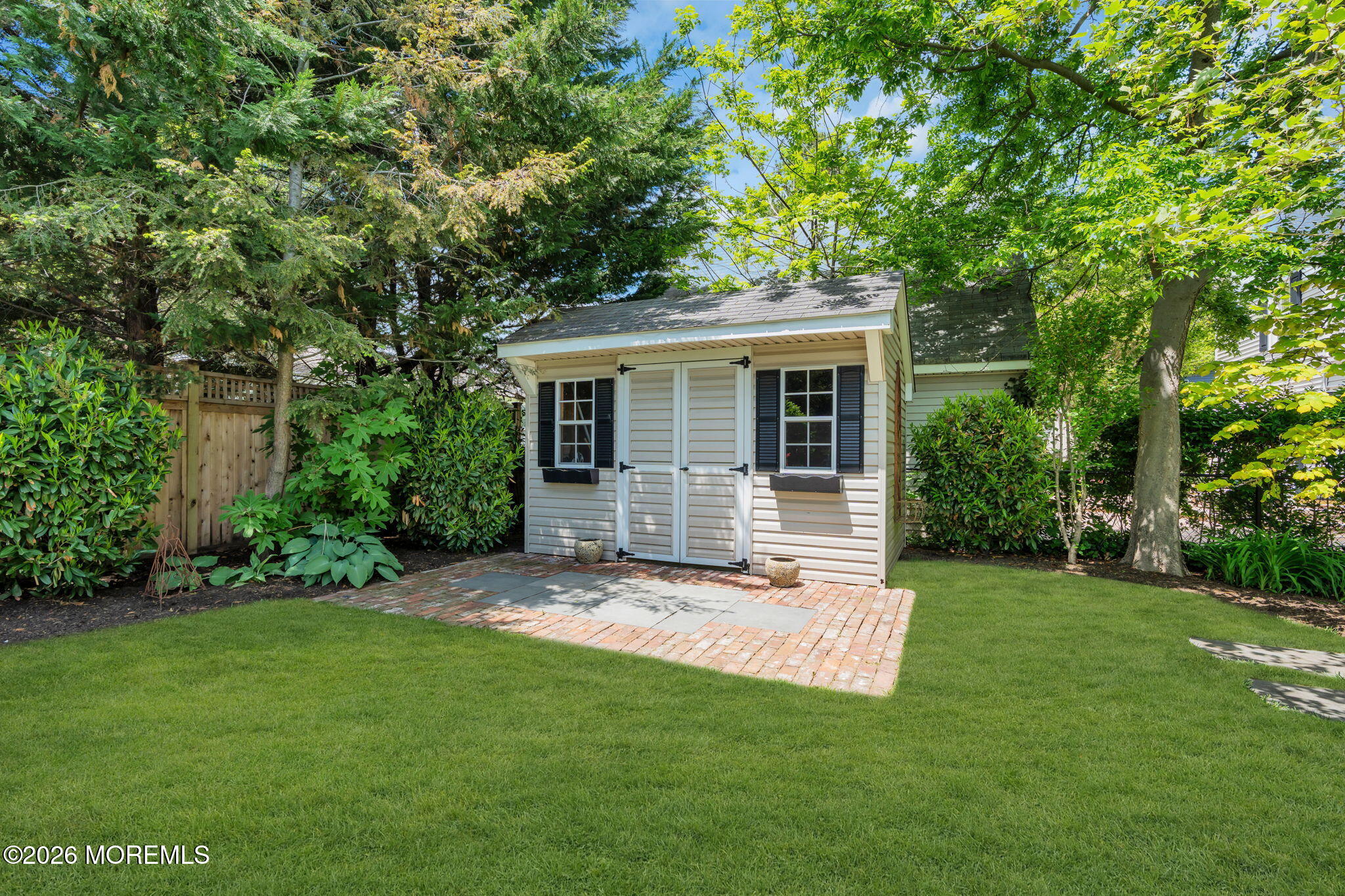 22 1st Street Rumson, NJ 07760 - Photo 40 of 44 a view of a house with a yard and sitting area