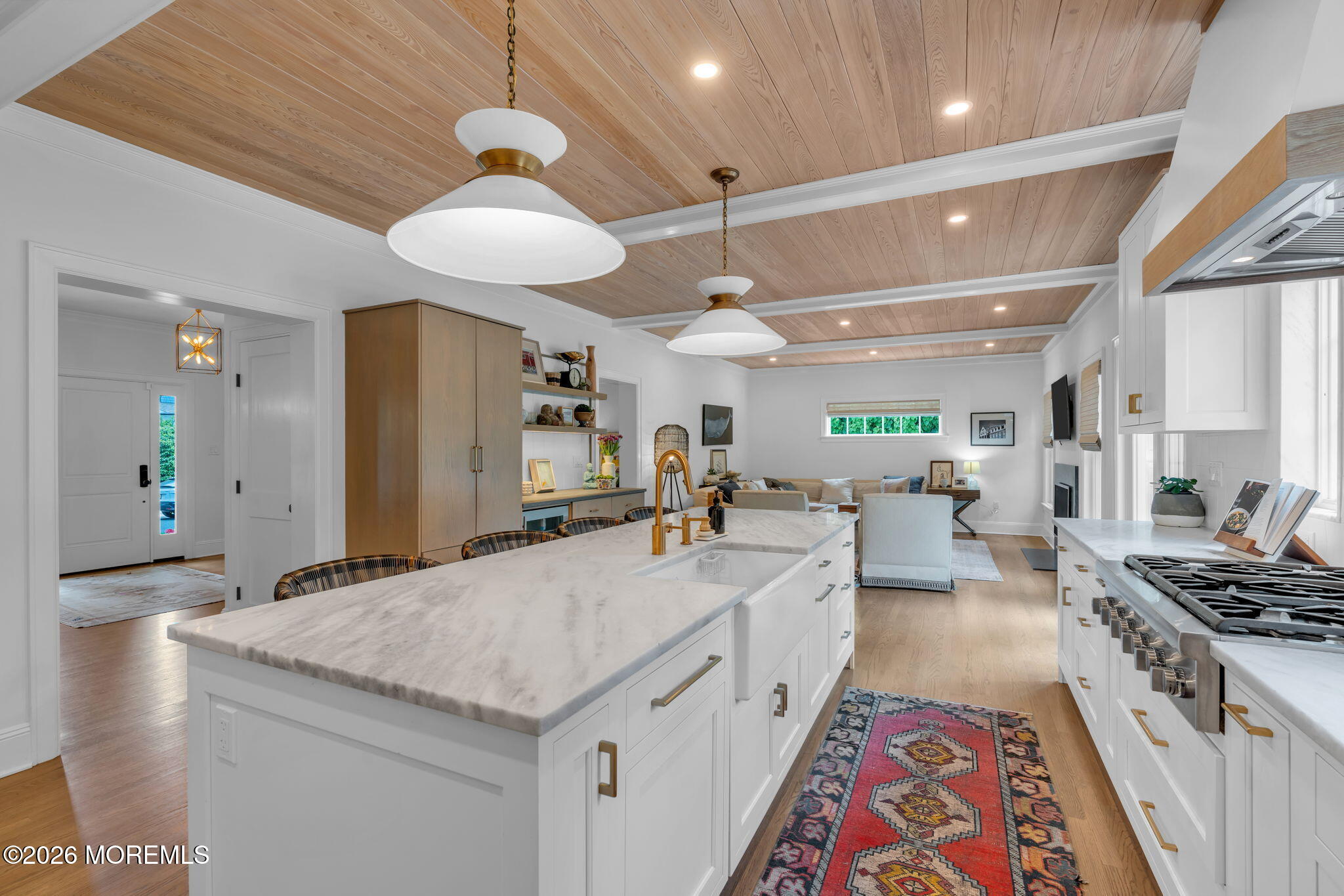 22 1st Street Rumson, NJ 07760 - Photo 6 of 44 a large kitchen with stainless steel appliances kitchen island granite countertop a lot of counter space