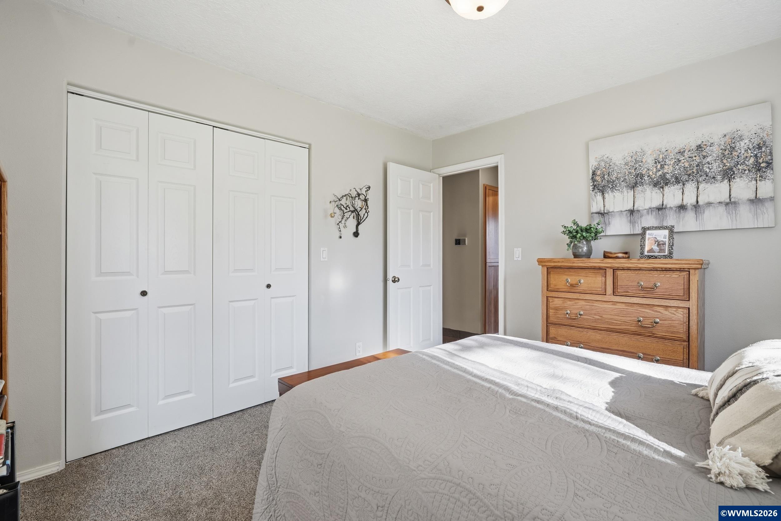 1110 Reuben Boise Road Dallas, OR 97338 - Photo 27 of 49 a bedroom with a bed and a dresser