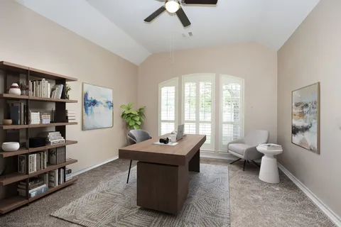 a view of a living room and dining room