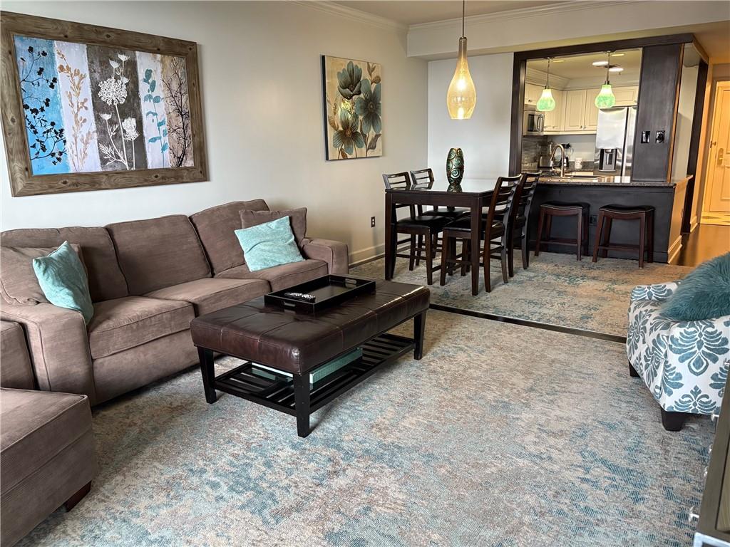 75 14th Street Northeast, Unit 3340 Atlanta, GA 30309 - Photo 1 of 24 a living room with furniture and wooden floor