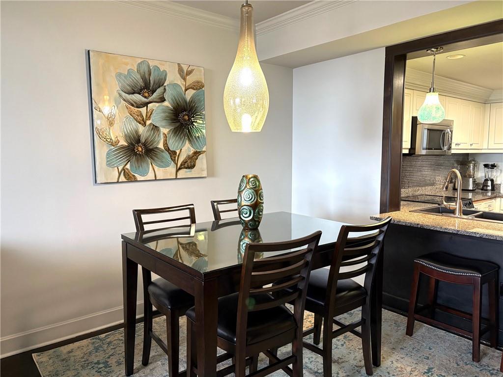 75 14th Street Northeast, Unit 3340 Atlanta, GA 30309 - Photo 7 of 24 a dining room with furniture and window